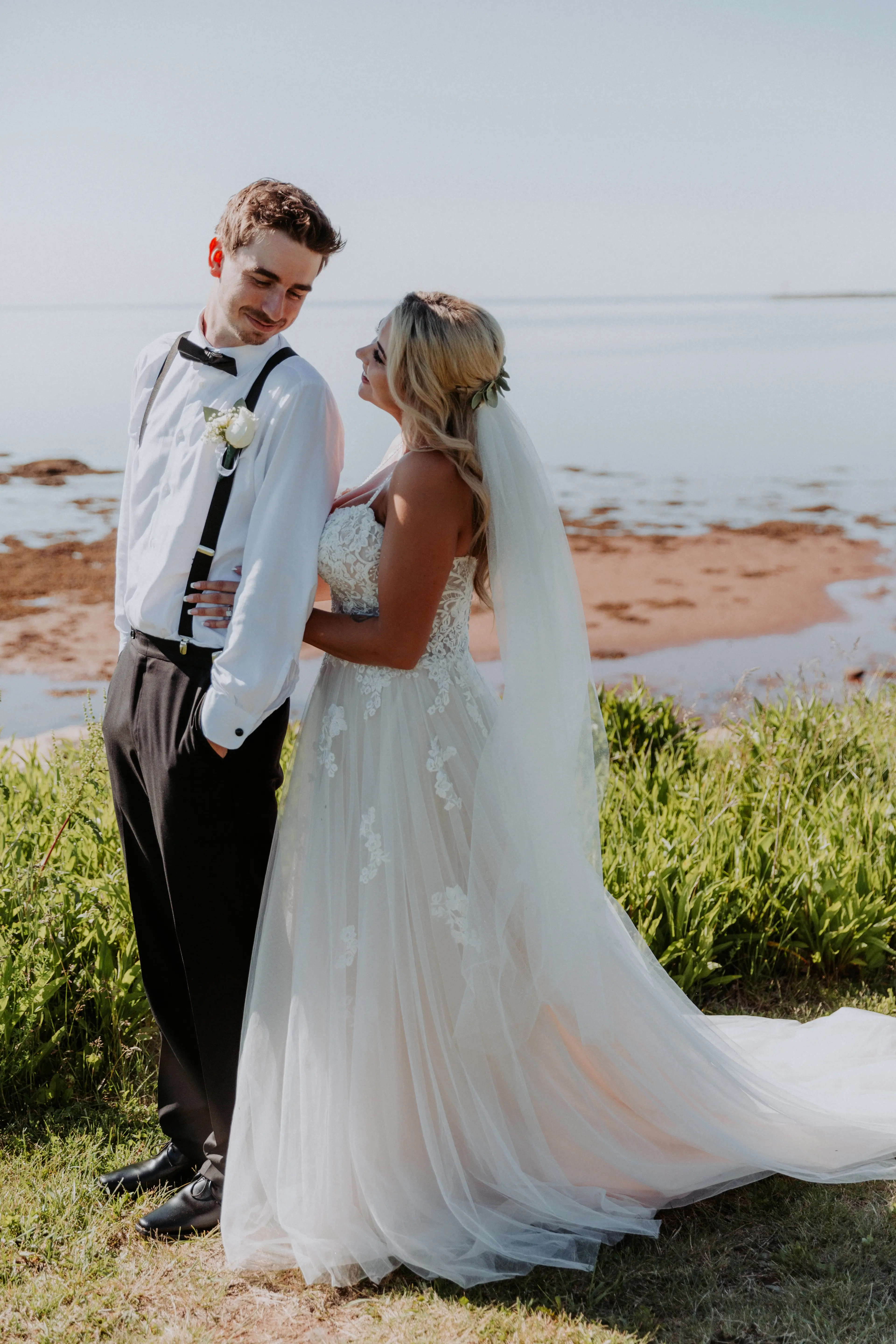 Groom with Bride in Flattering A-Line Spaghetti Strap Wedding Dress with Romantic Lace Called Marisol by Rebecca Ingram