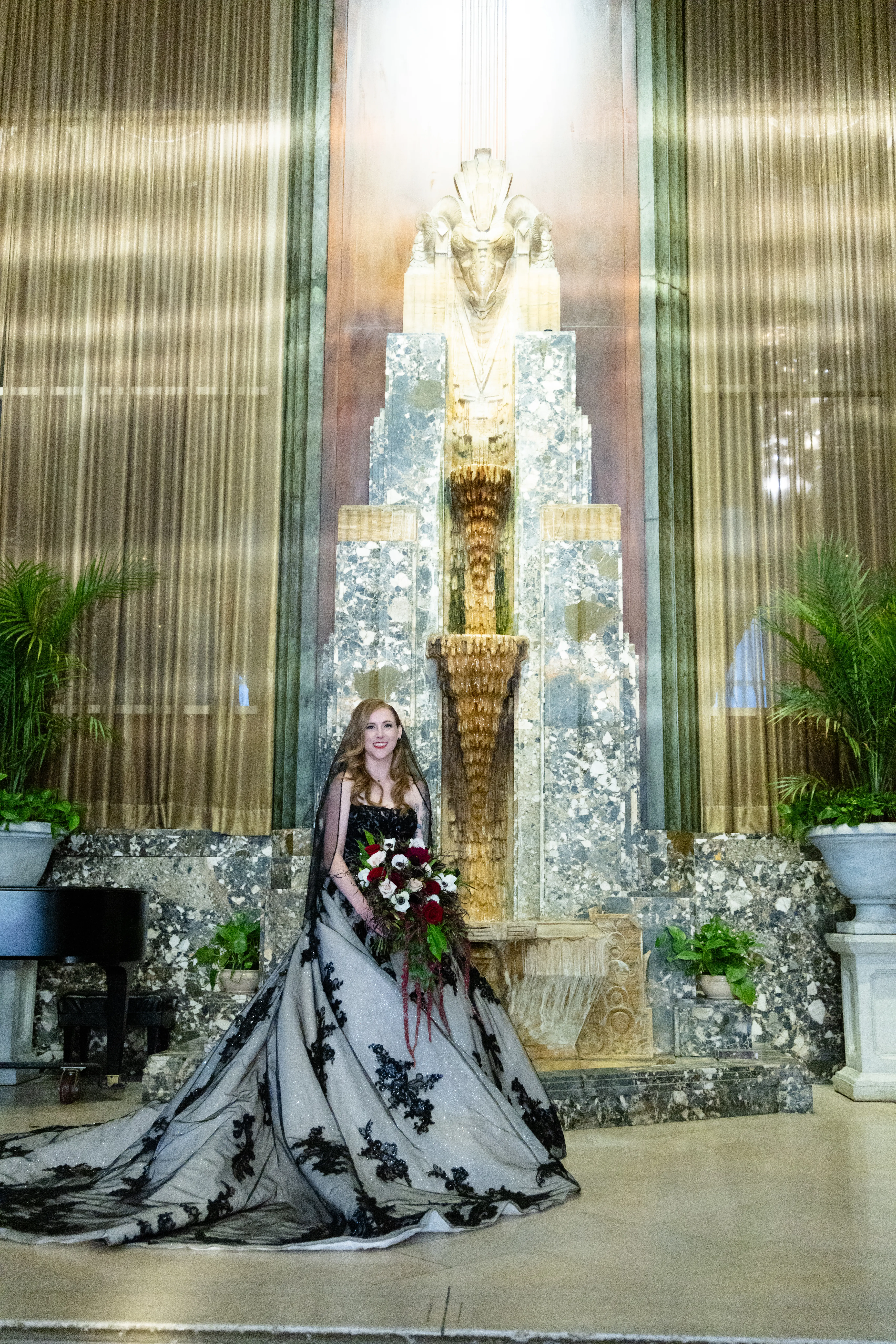Bride wearing Norvinia wedding dress by Sottero and Midgley standing in beautiful venue