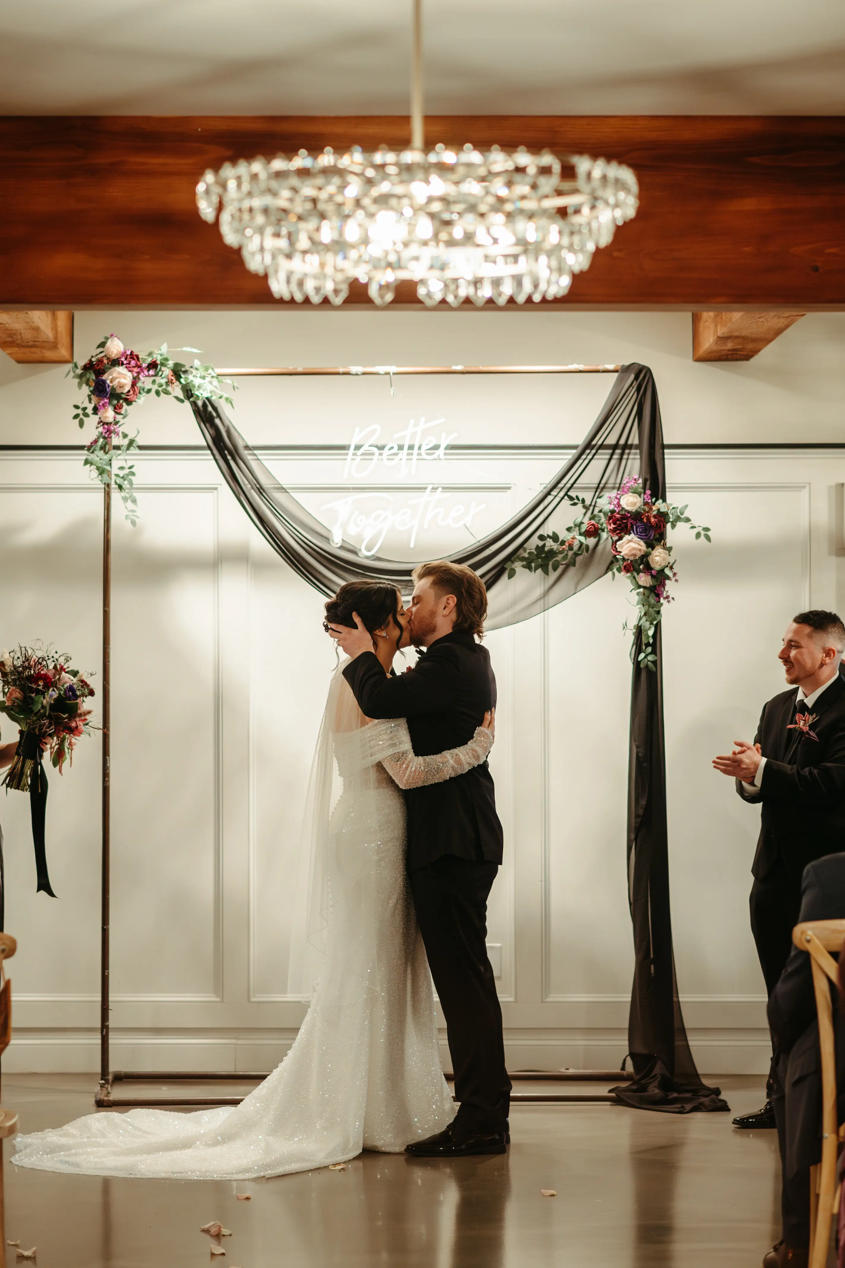 Bride Wearing Pearl Sparkly Wedding Dress Called Drew By Maggie Sottero And Groom Kissing At The Ceremony