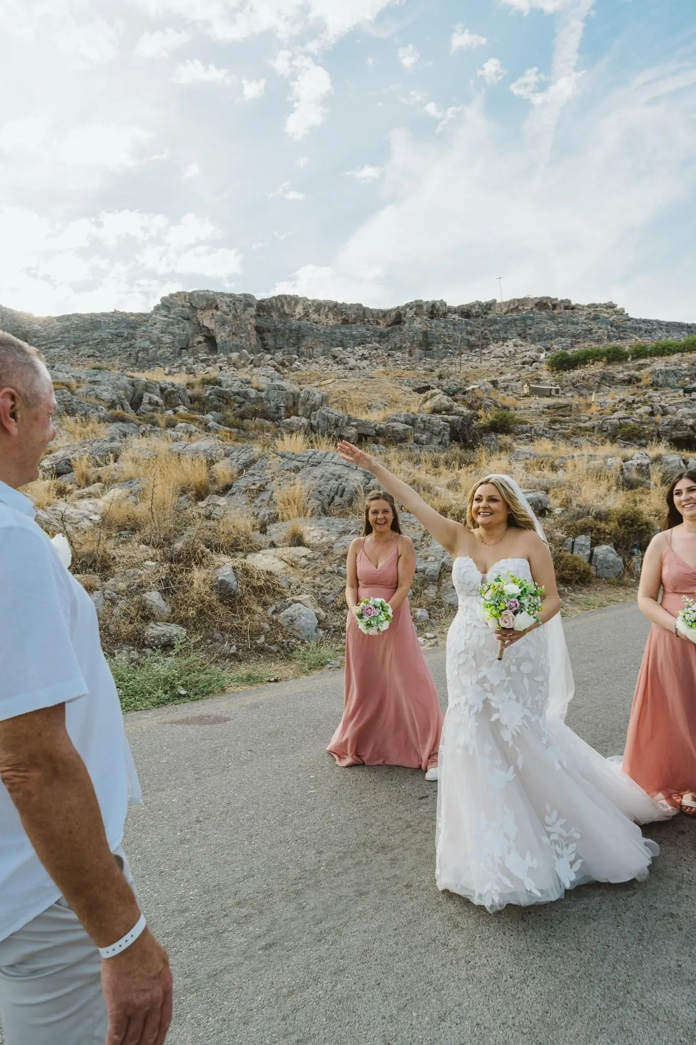 Bride wearing Hattie wedding dress by Rebecca Ingram greeting a friend