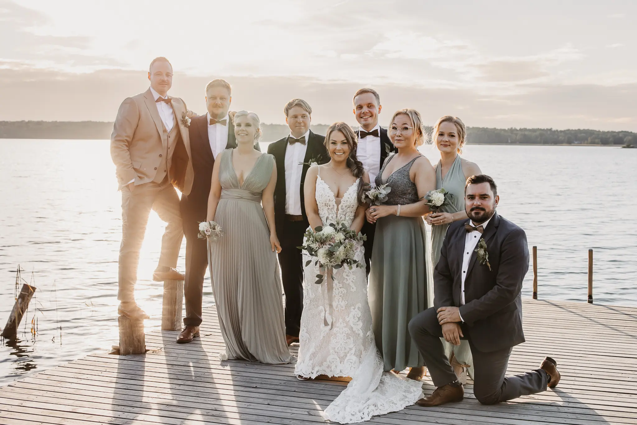 Bride Wearing Sexy Lace Wedding Dress Called Tuscany Lynette By Maggie Sottero With Bridal Party On A Dock
