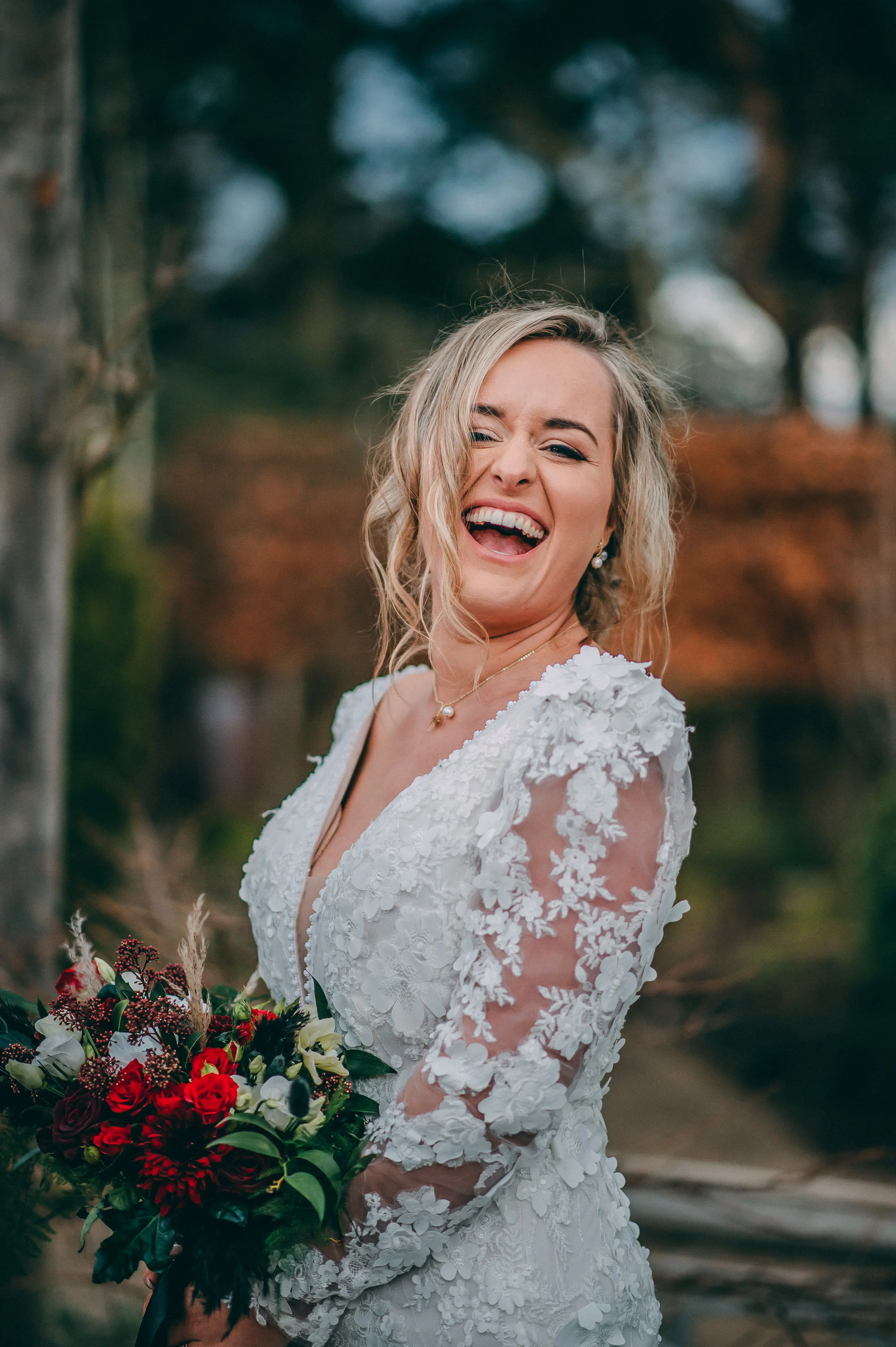 Bride Wearing Vintage Mermaid Wedding Dress With 3-D Floral Motifs Cruz By Sottero And Midgley