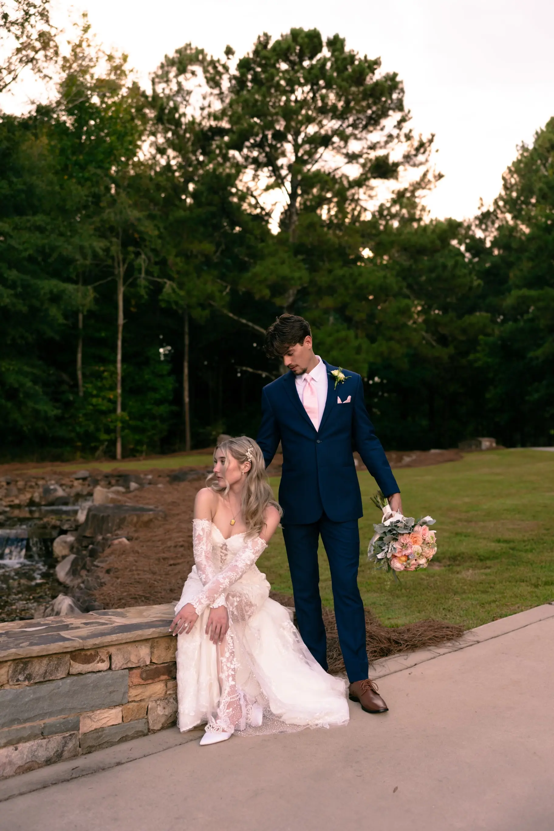 Bride wearing Kensington by Sottero and Midgley sitting with her husband