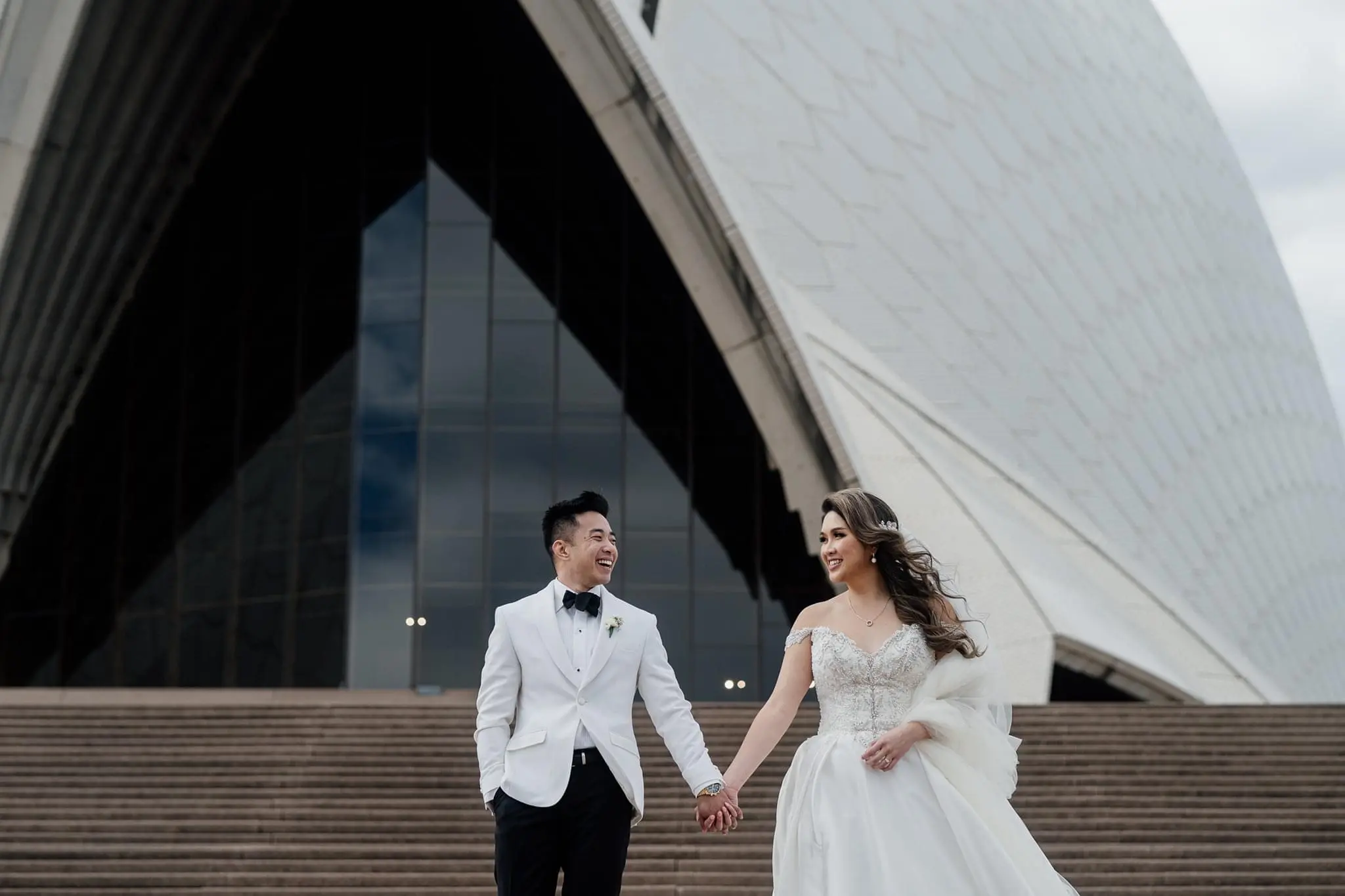 Bride Wearing Princess Ballgown Wedding Dress Called Kimora By Sottero And Midgley Holding Hands With Groom