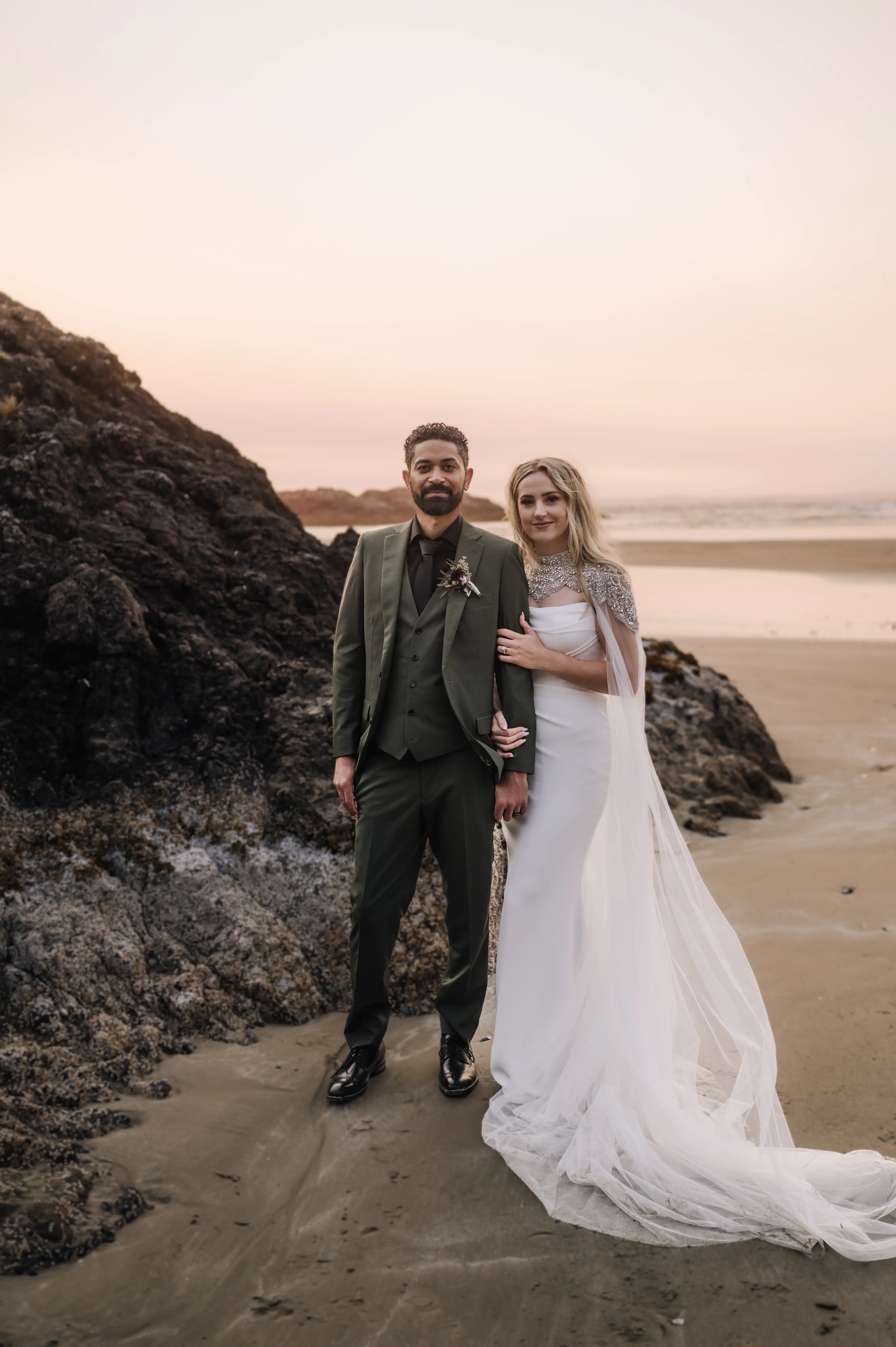 Bride wearing Summer wedding dress by Maggie Sottero with her husband