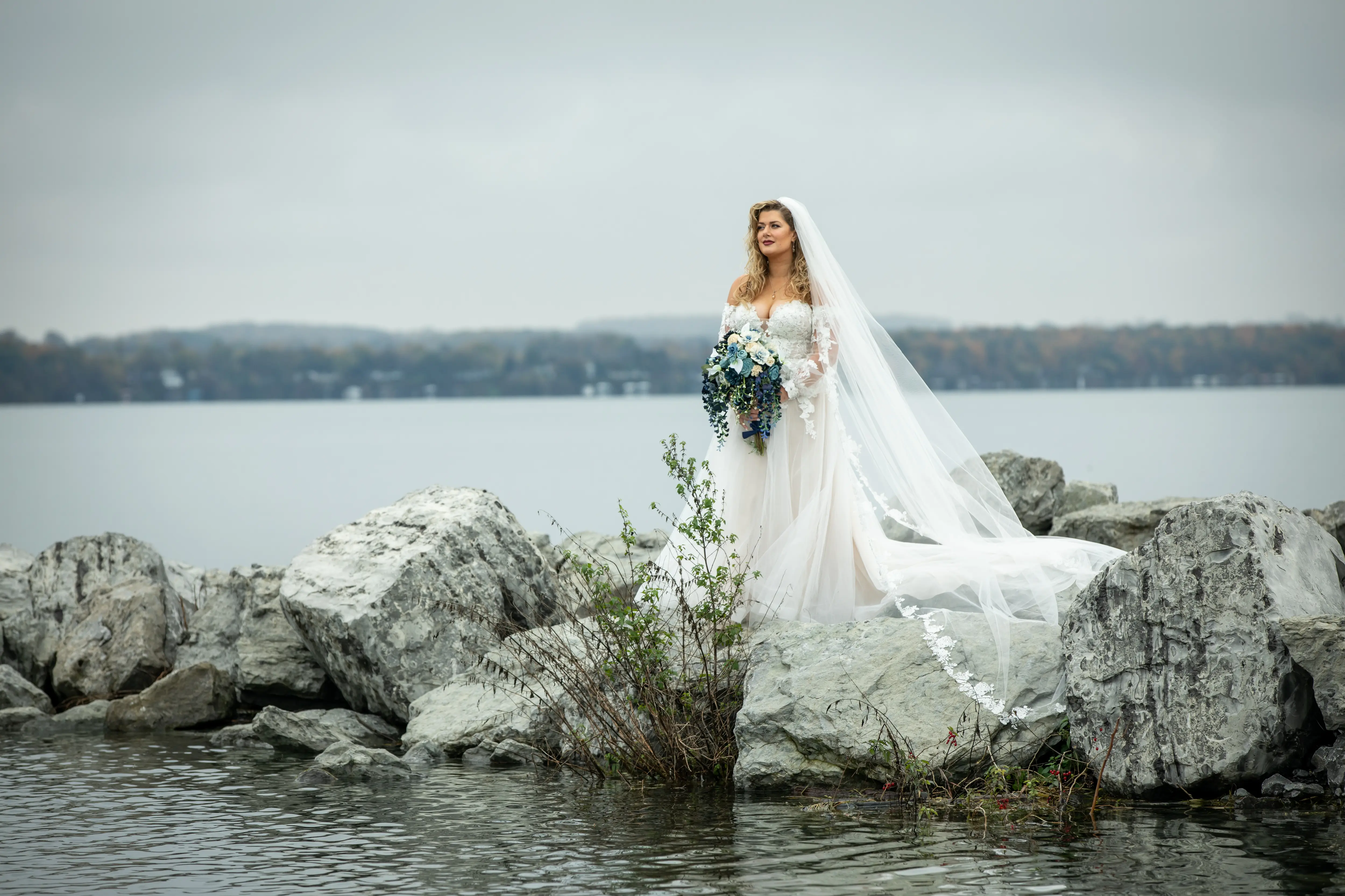 Bride Wearing Boho A-Line Wedding Dress Called Stevie By Maggie Sottero On A Rocky Lake Front