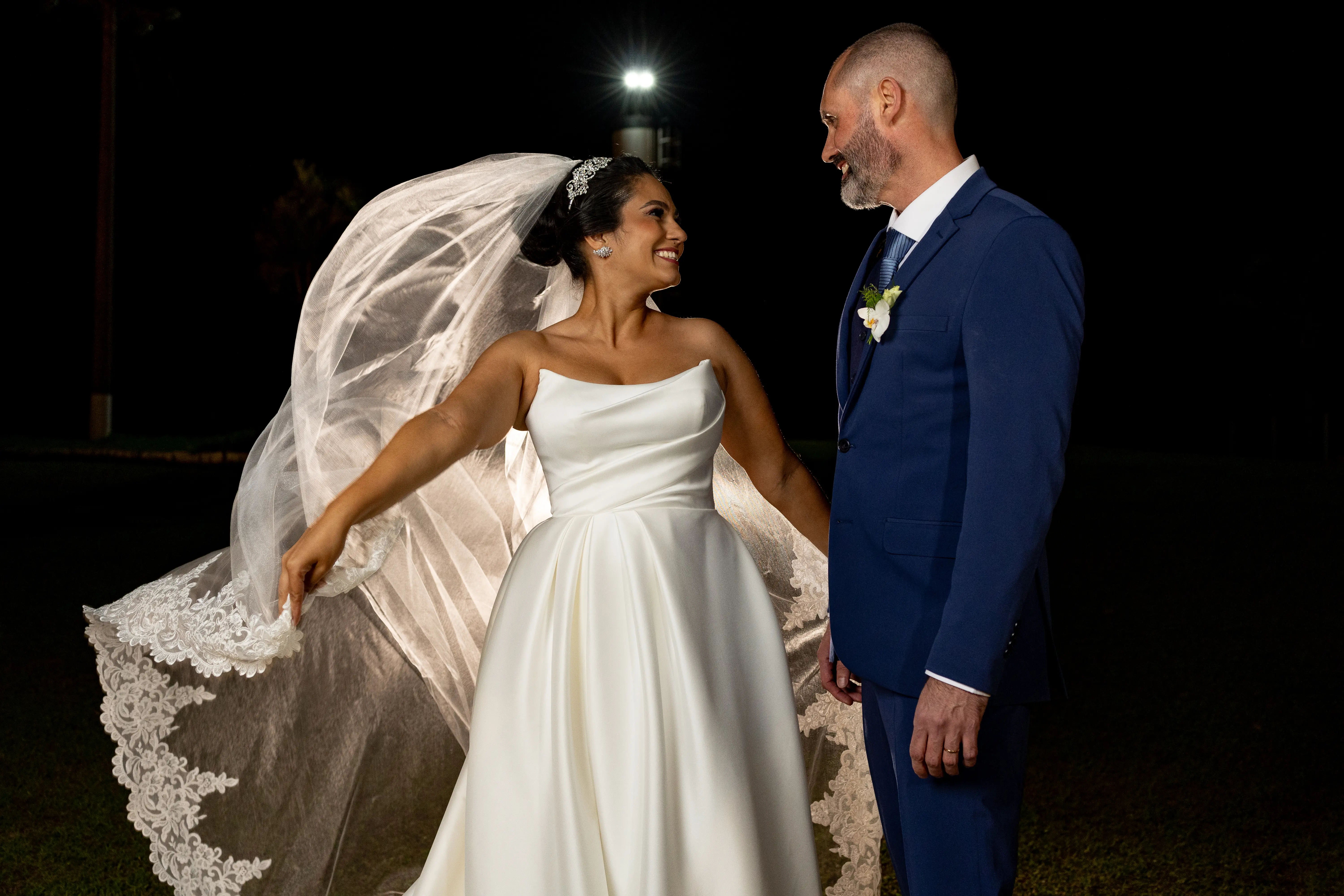 Bride wearing Aspen wedding dress by Sottero and Midgley with her husband