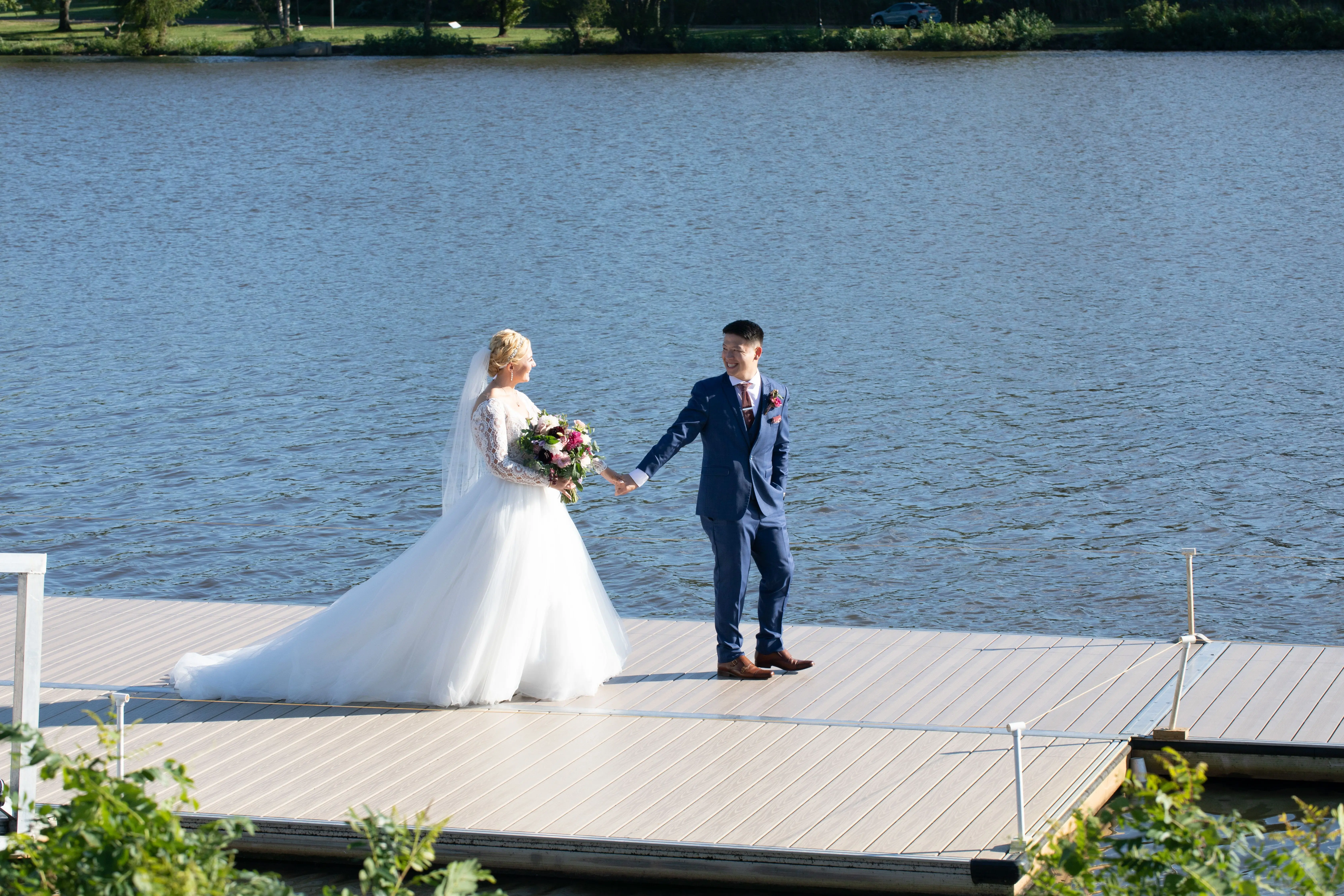 Bride Wearing Princess Ballgown Wedding Dress Called Mallory Dawn By Maggie Sottero Walking With Groom