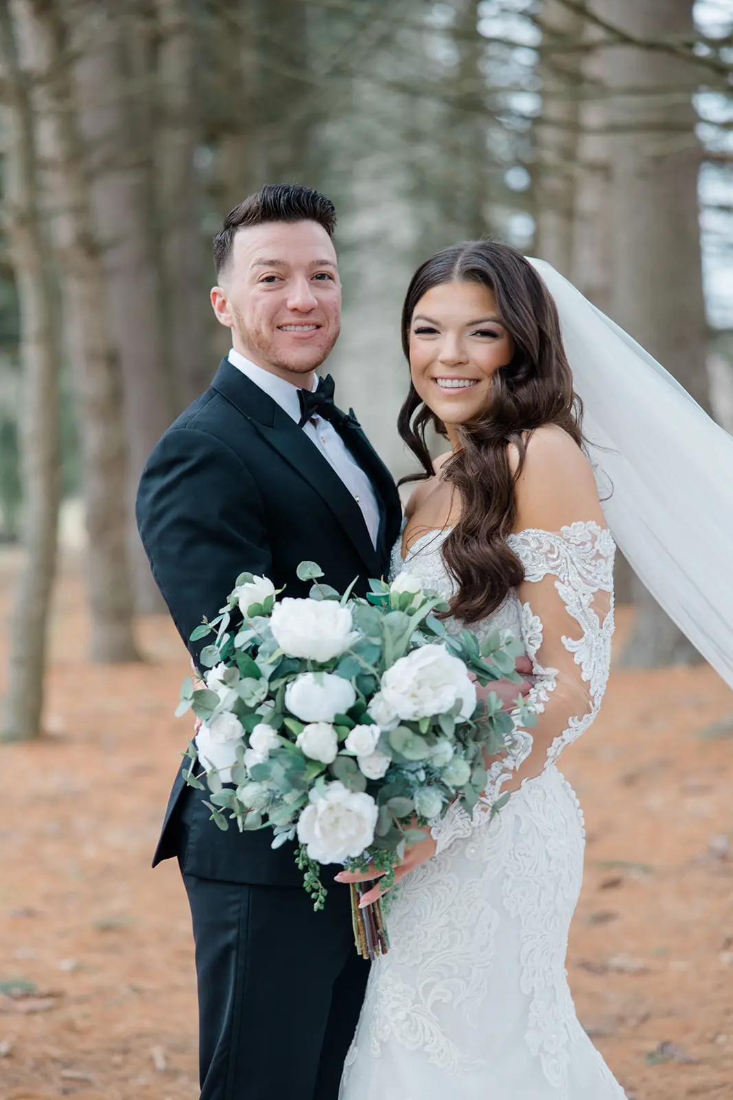 Groom With Bride Wearing Sparkly Lace Wedding Dress With Long Sleeves Called Fiona