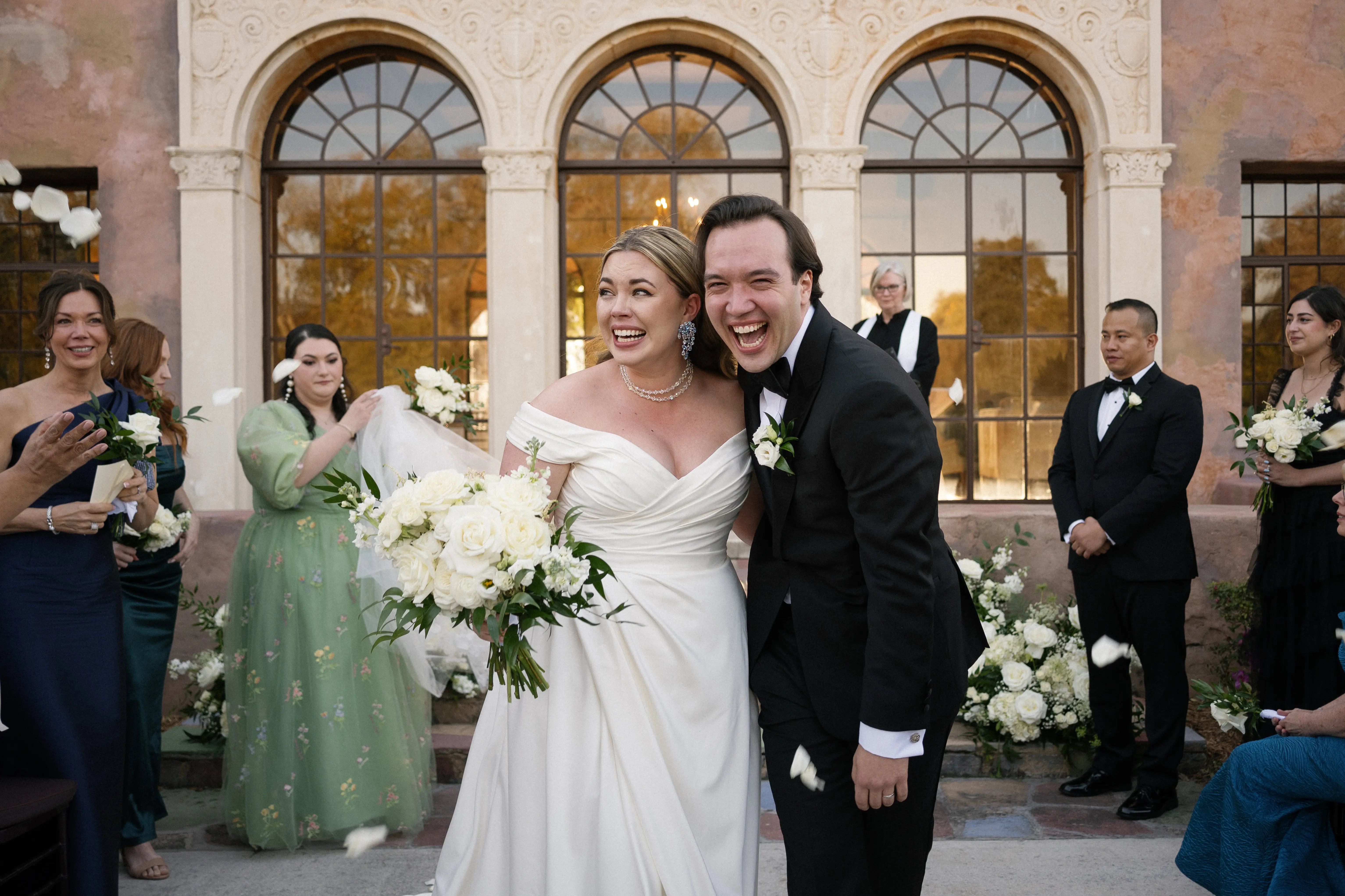 Bride wearing Ekaterina by Maggie Sottero embracing her husband