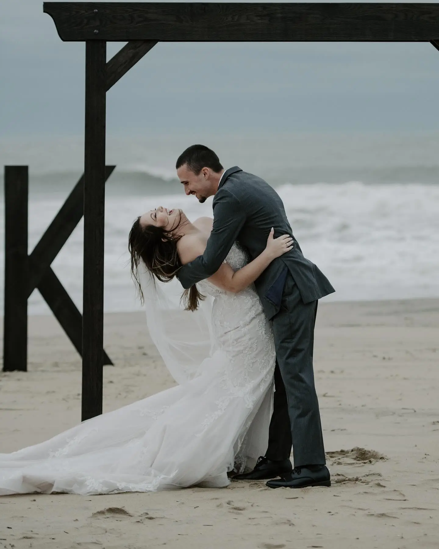 Bride wearing Frederique wedding gown by Maggie Sottero dancing with groom