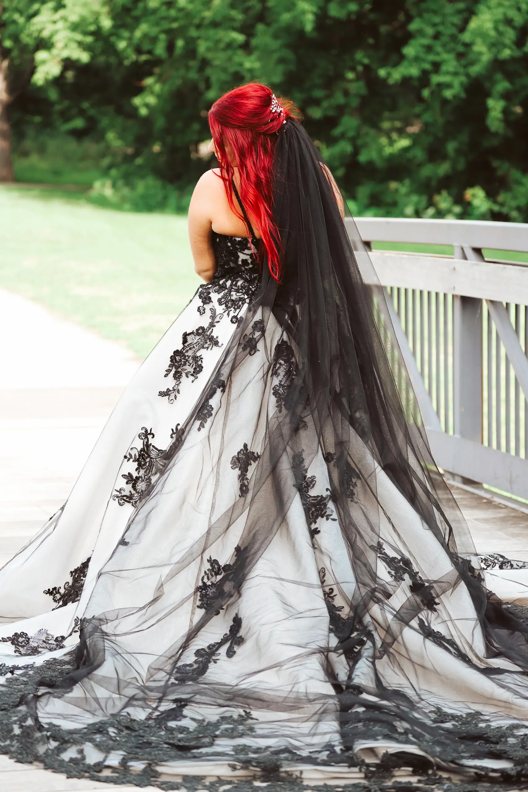 Bride Wearing Royal-Inspired Ball Gown Wedding Dress In Black Lace Called Norvinia By Sottero And Midgley