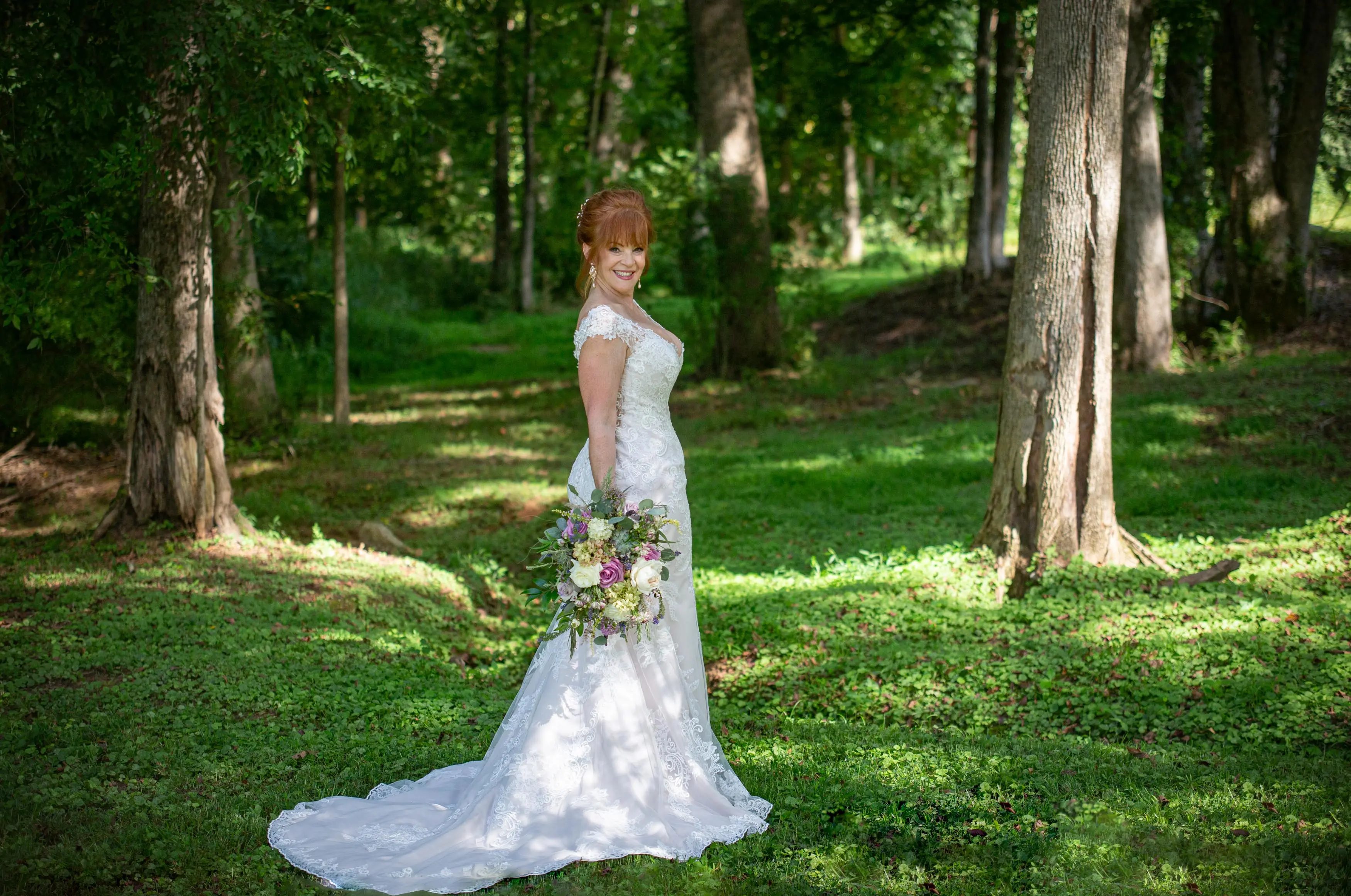 Bride at Outdoor Wedding Wearing a Lace Bridal Dress Called Daphne Lynette by Rebecca Ingram