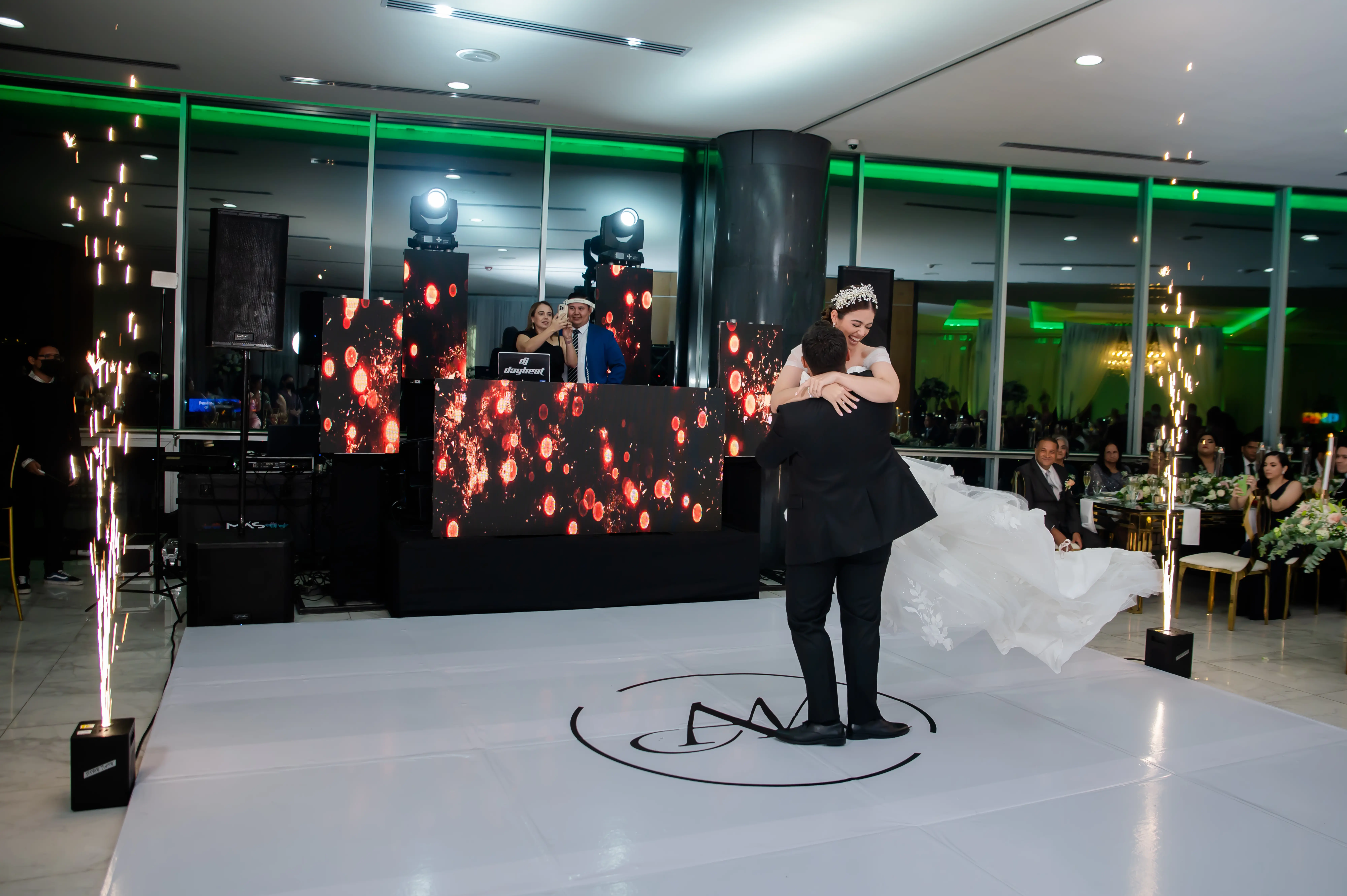 Groom Spinning Bride on Dance Floor at Reception Wearing a Wedding Dress Called Hattie by Rebecca Ingram