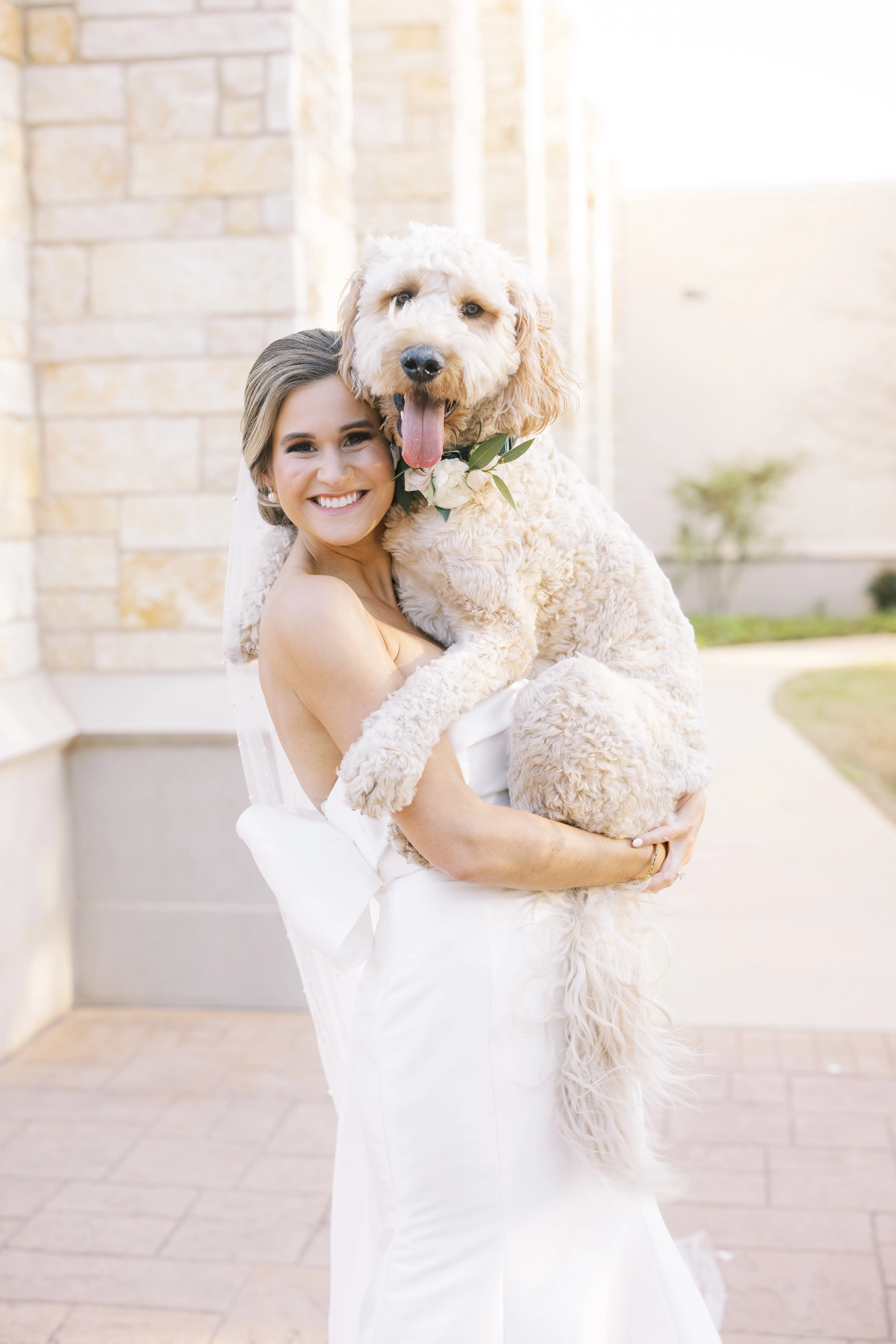 Bride Wearing Simple Sheath Wedding Dress With Bow Back Called Mitchell By Maggie Sottero