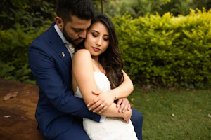 Bride with groom wearing affordable, strapless mermaid wedding dress.