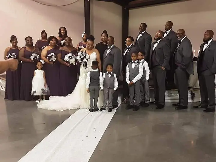 Groom With Bride Wearing Lace Mermaid Style Dress Called Alistaire Lynette By Maggie Sottero