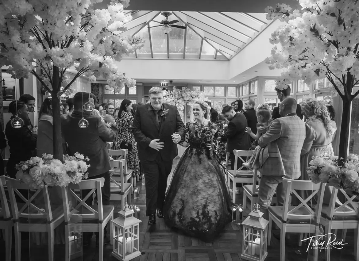 Groom With Bride In A Black Lace Ball Gown Wedding Dress Named Zander By Sottero And Midgley