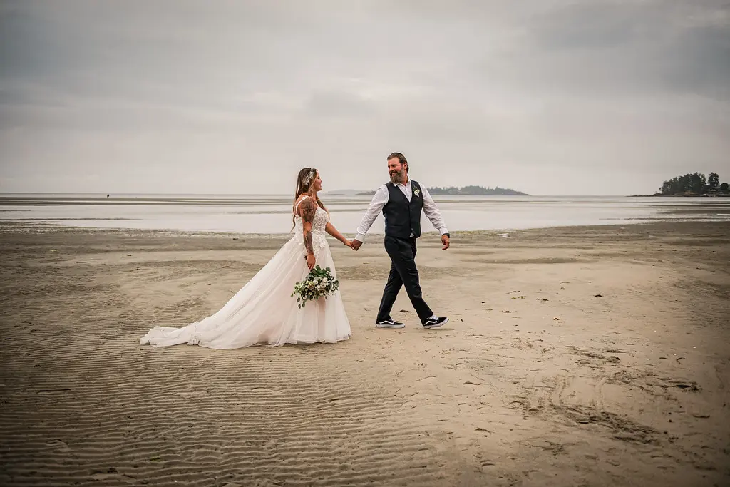 Bride wearing Boho Wedding Dress called Stevie by Maggie Sottero on the beach with her groom