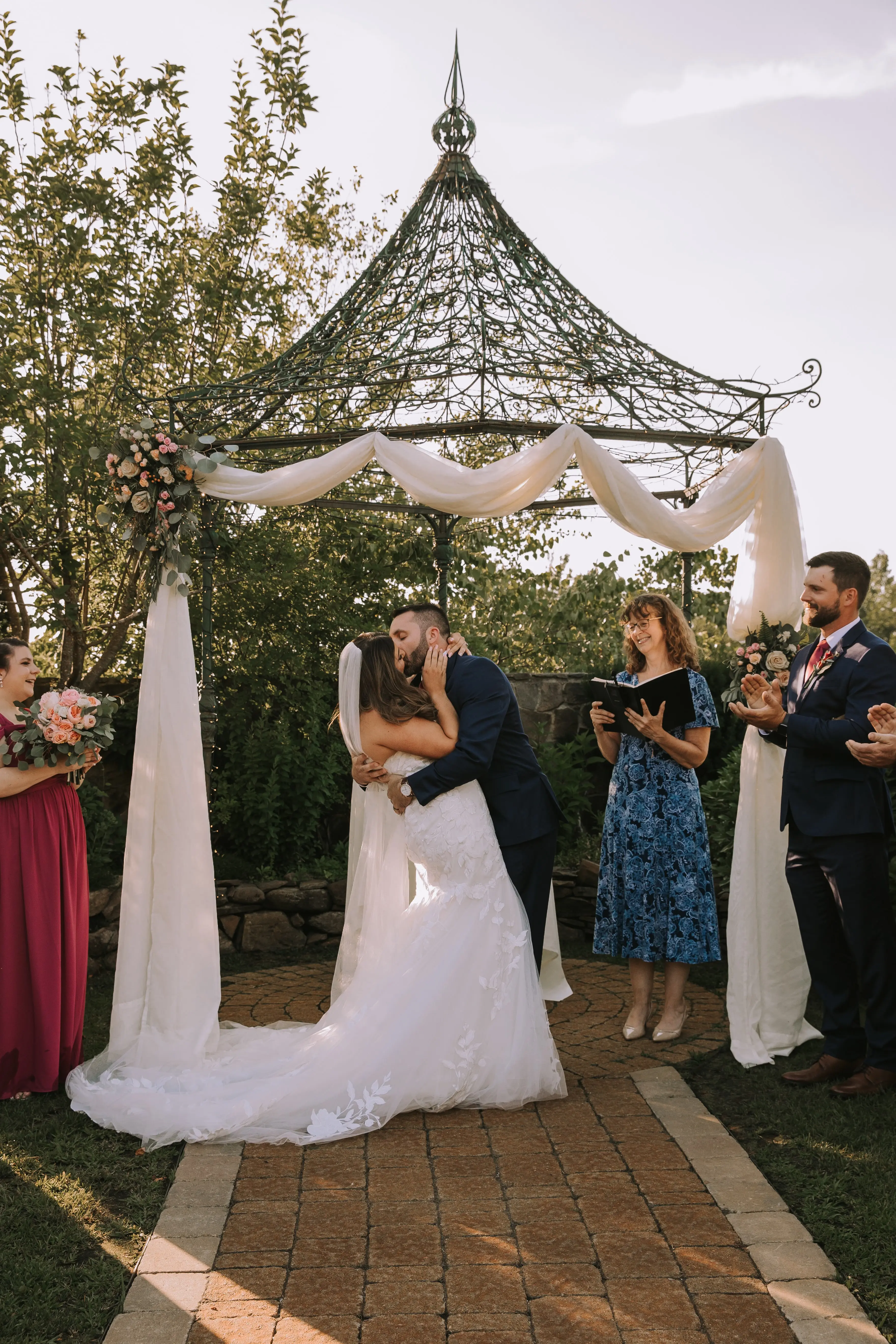 Bride Wearing Lace Mermaid Wedding Gown Called Hattie By Rebecca Ingram Kissing Groom