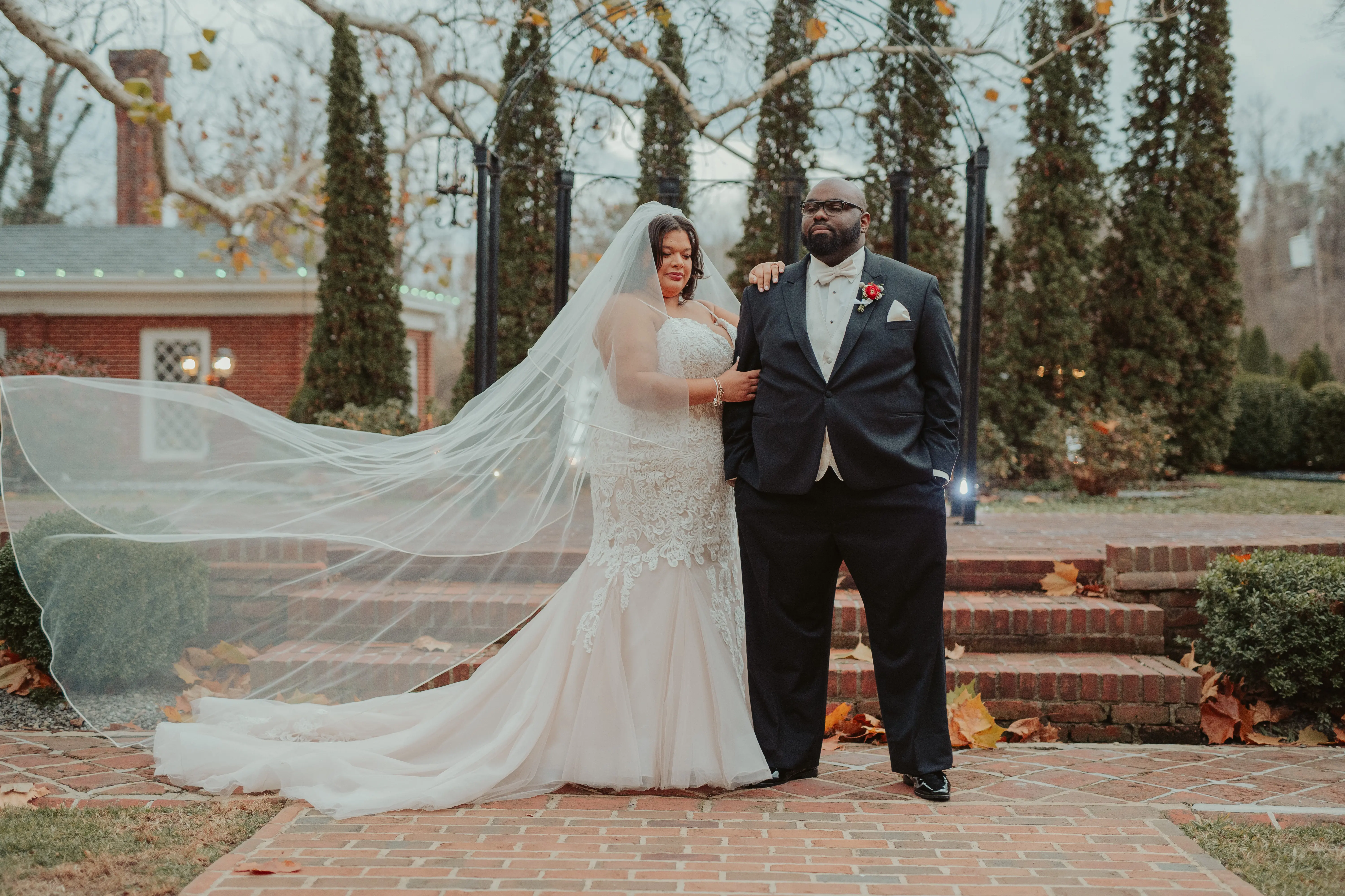 Bride With Groom Outside Wearing Bridal Gown Called Alistaire Lynette by Maggie Sottero