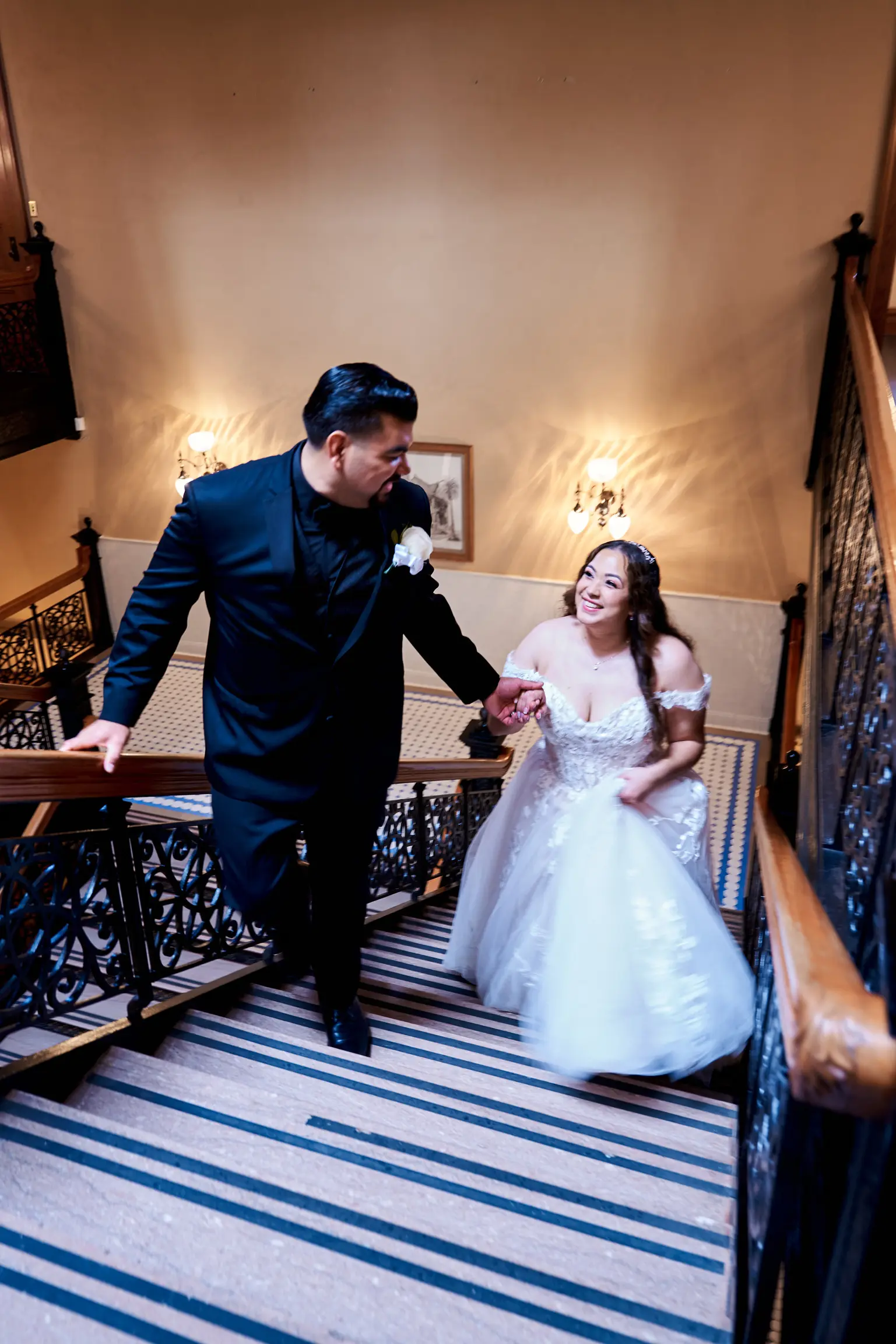 Bride Wearing Lace Ballgown Wedding Dress Called Harlem By Maggie Sottero Holding Hands With Groom