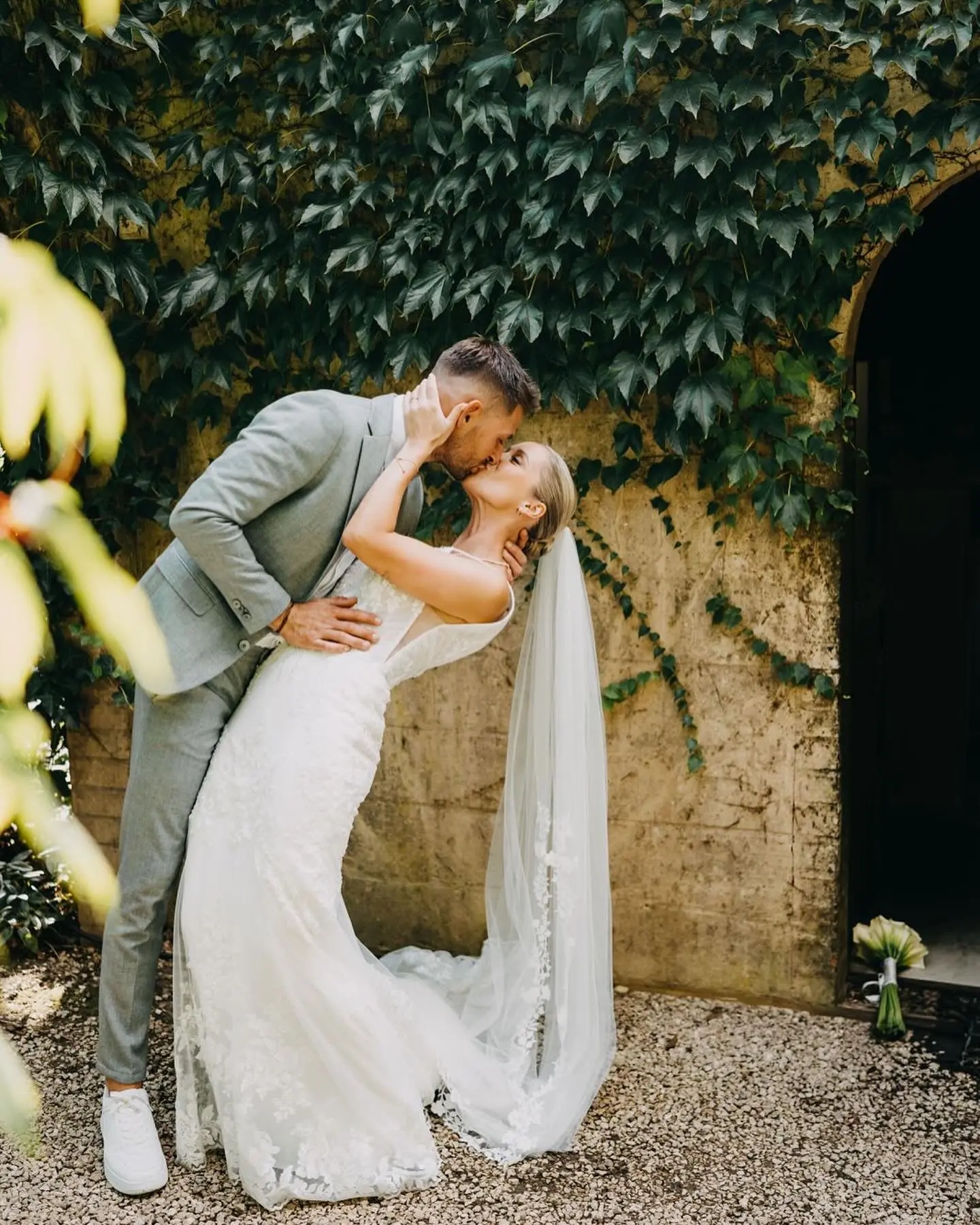 Bride wearing Fontaine by Maggie Sottero kissing her husband
