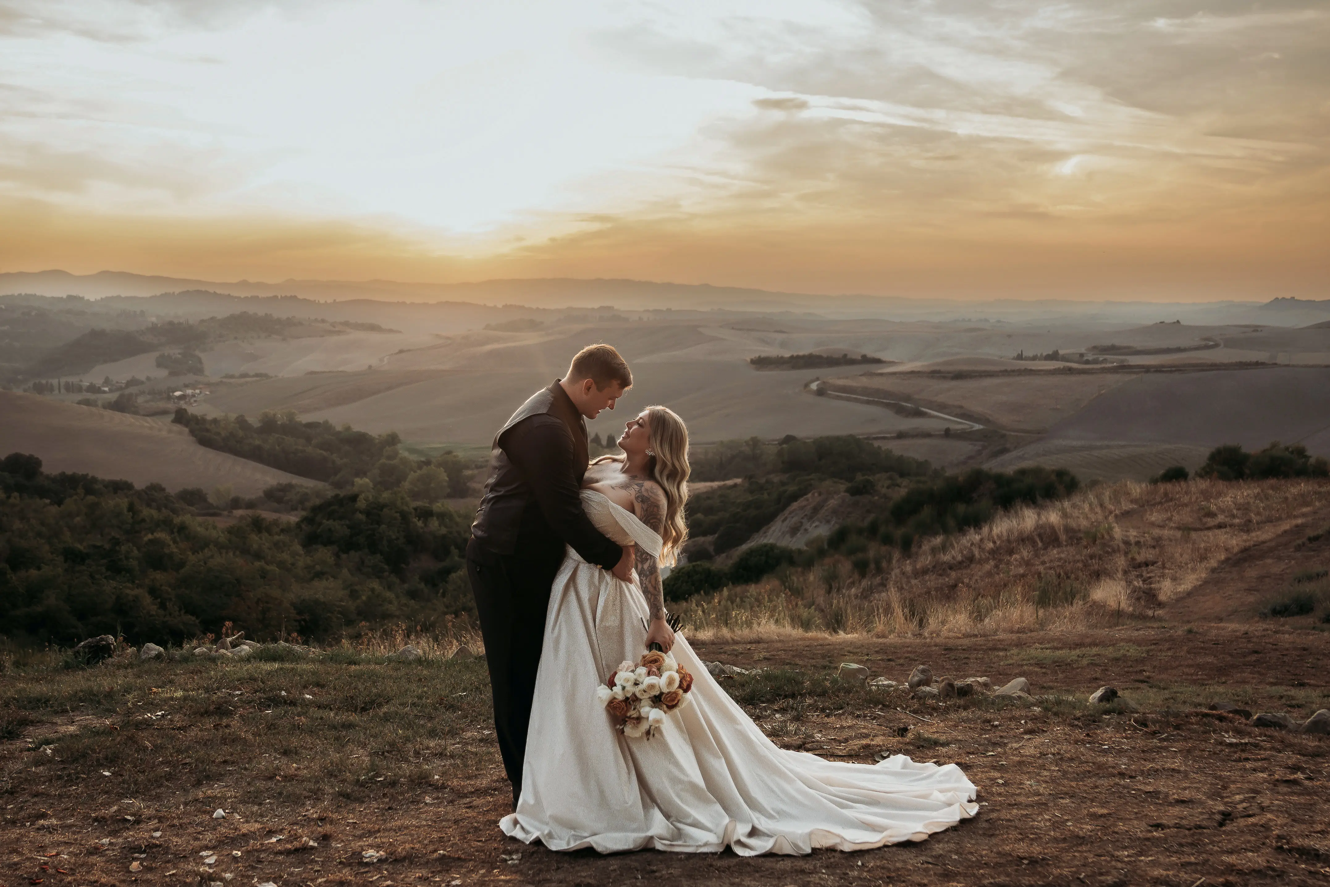 Bride wearing Anniston by Maggie Sottero embracing her husband
