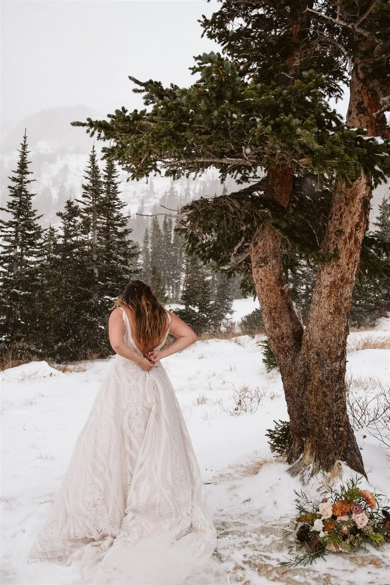 Bride Getting Ready After Hiking to Elopement Location in Boho Princess A-line Wedding Dress with Allover Sequin Lace and Sheer Bodice with Illusion Side Panels Called Roxanne by Sottero & Midgley