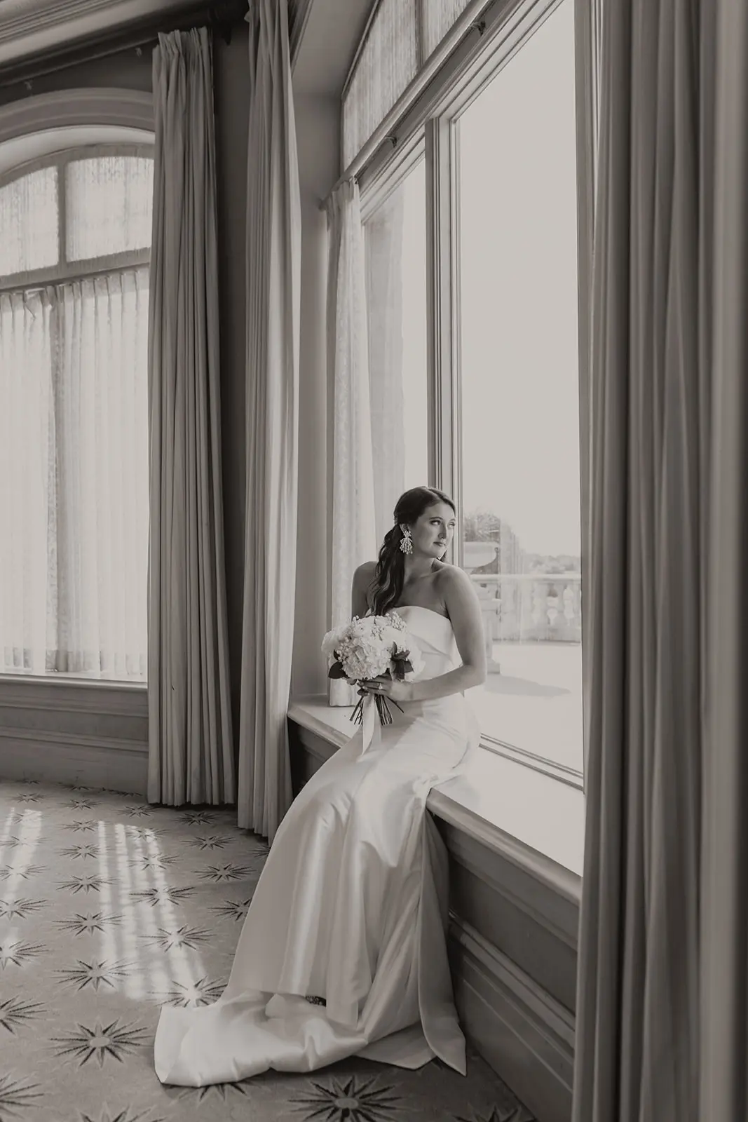 Bride Wearing Strapless Wedding Dress Featuring Big Bow Mitchell By Maggie Sottero