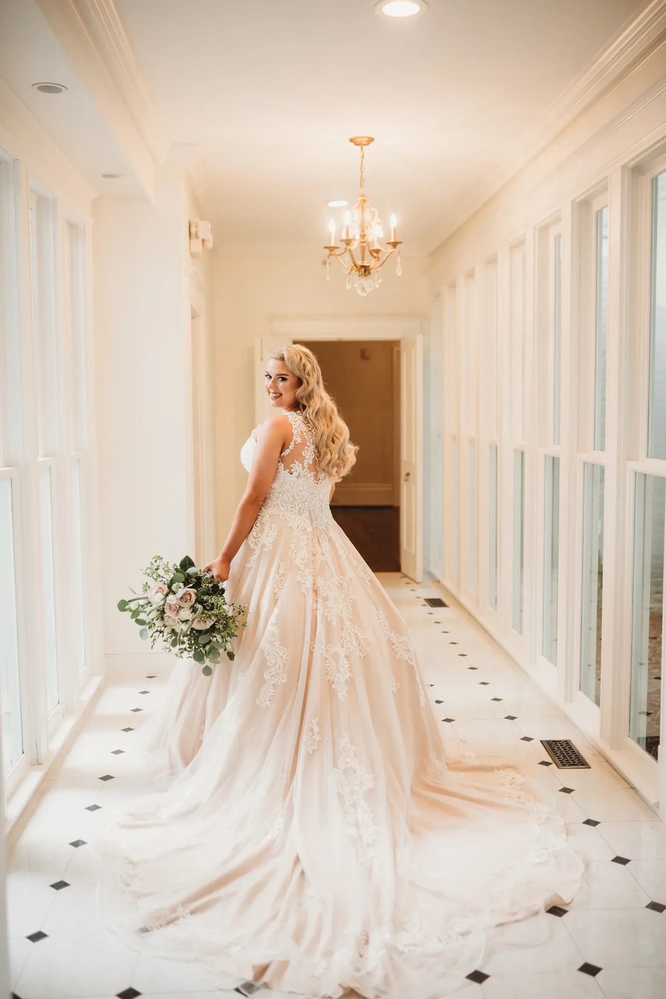 Bride wearing a plus size ballgown wedding dress.