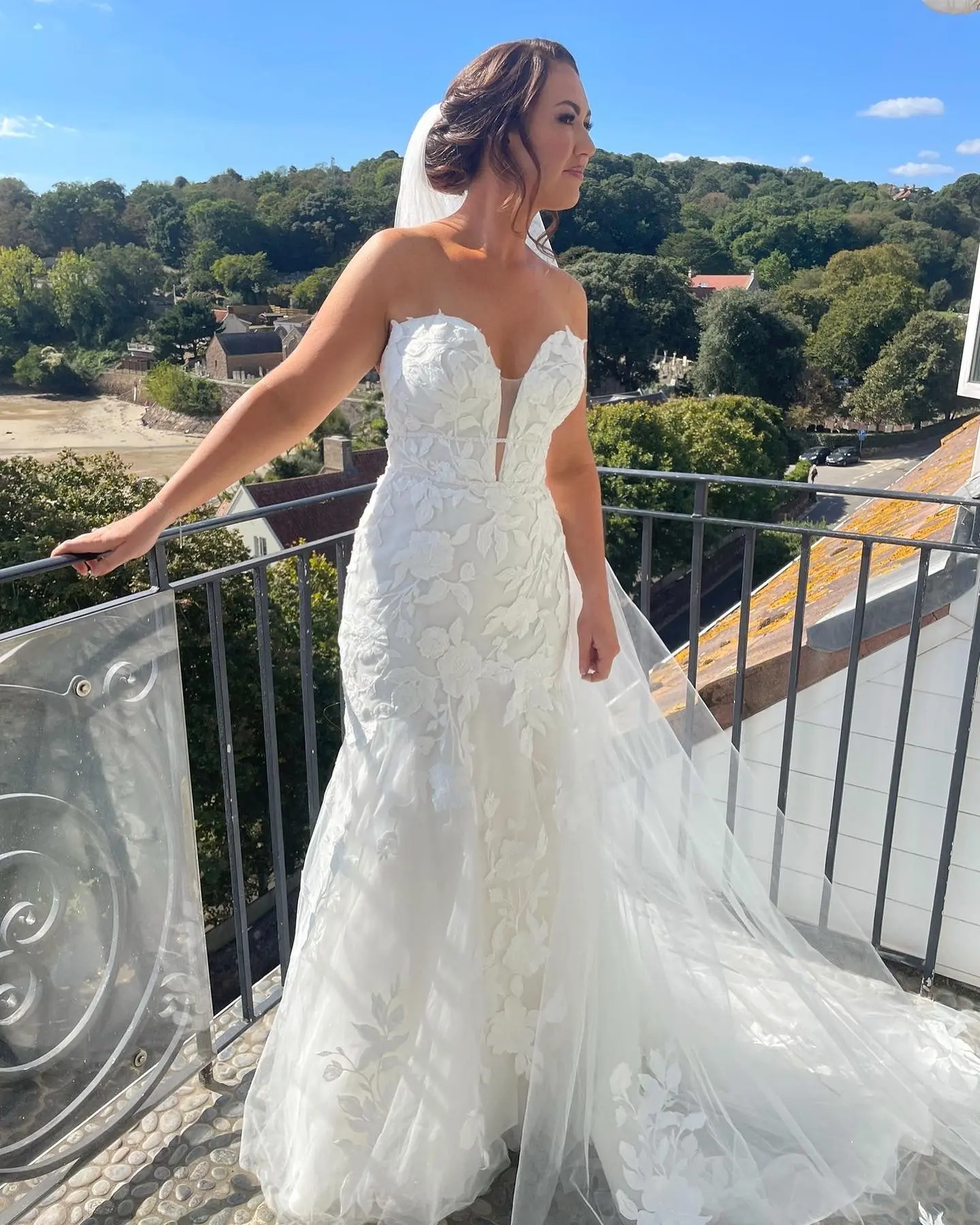 Bride Wearing Lace Mermaid Wedding Dress Called Hattie By Rebecca Ingram On A Balcony