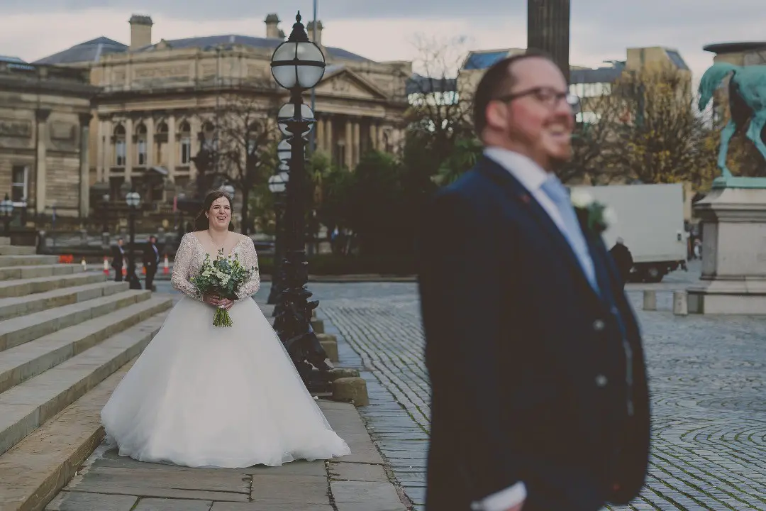 Bride Wearing Dreamy Long Sleeve Ballgown Wedding Dress Called Mallory Dawn By Maggie Sottero Sees Groom From Behind