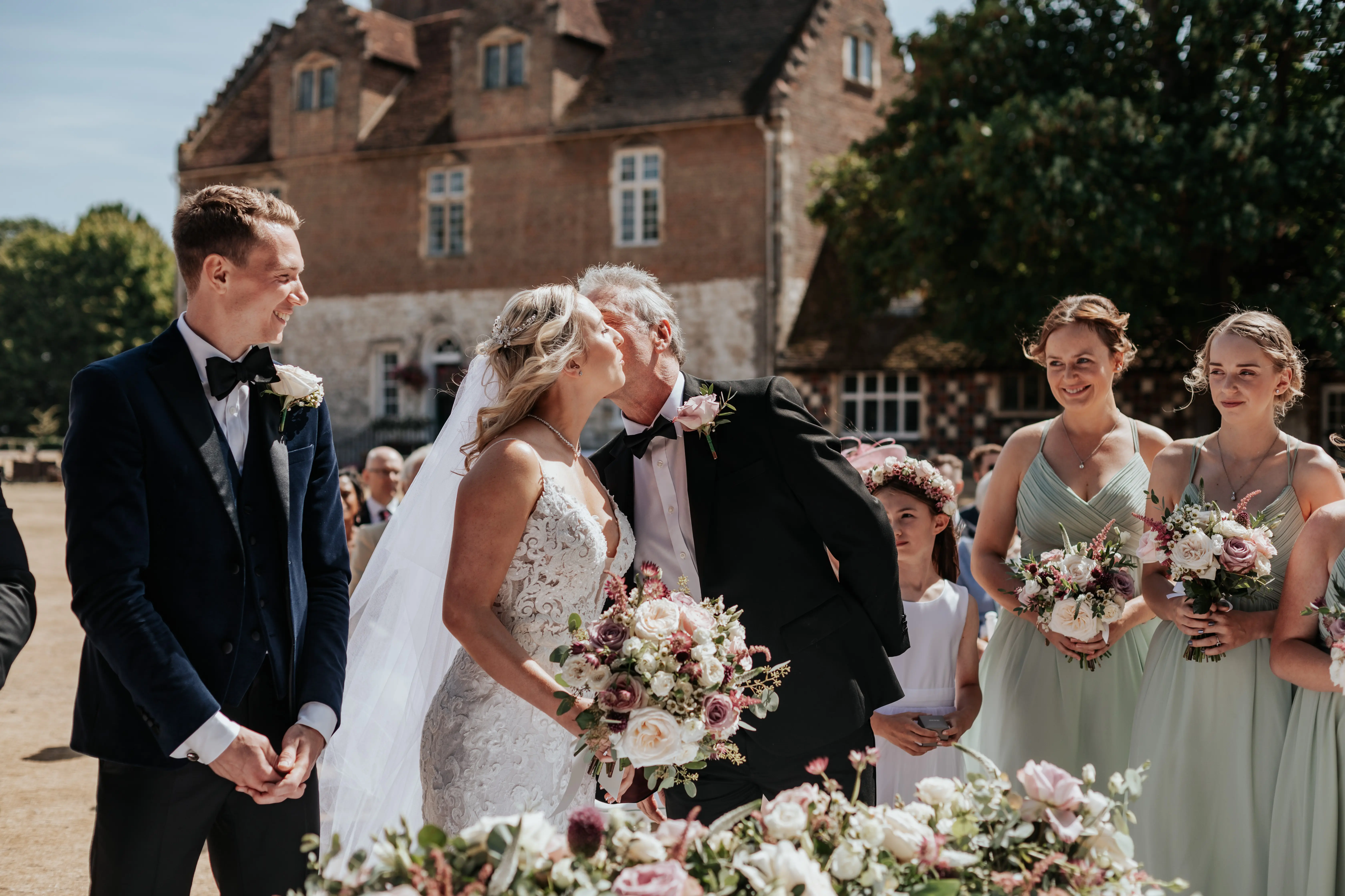 Real Bride in Lace Sheath Wedding Gown with Illusion Plunging Sweetheart Neckline Called Tuscany Lynette by Maggie Sottero