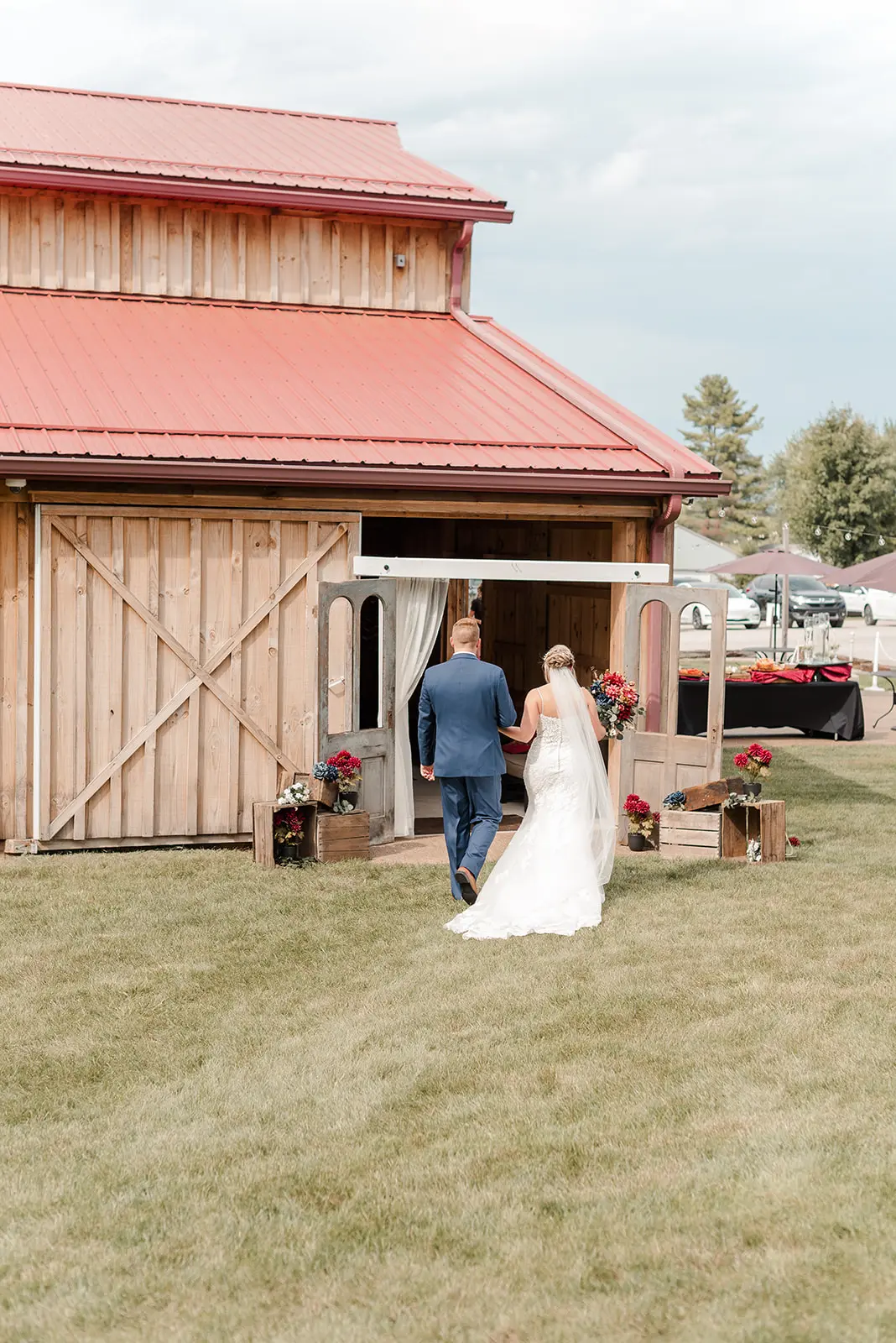 Bride Wearing Sexy Mermaid Lace Wedding Dress Called Fiona By Maggie Sottero Walking With Groom To Their Rustic Venue