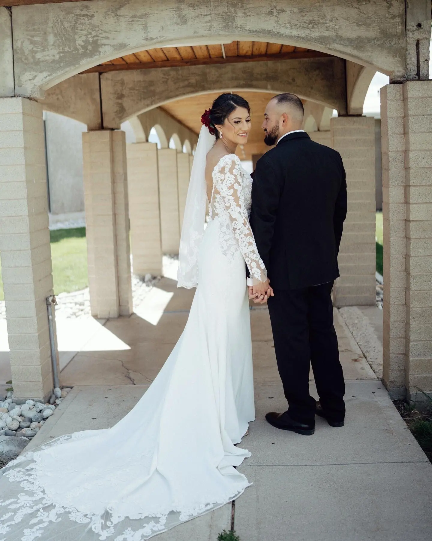 Groom with Bride in Long Illusion Lace Puff Sleeve Mermaid Wedding Gown Called Nikki by Maggie Sottero