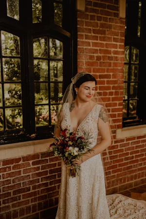 Bride Wearing Boho Lace Aline Wedding Gown Called Finley Dawn by Sottero and Midgley