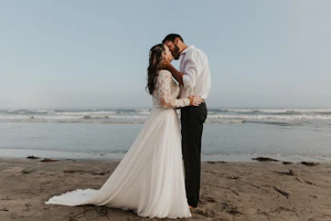 Groom With Bride Wearing Illusion Lace Long Sleeved Wedding Dress Lorraine Dawn By Rebecca Ingram