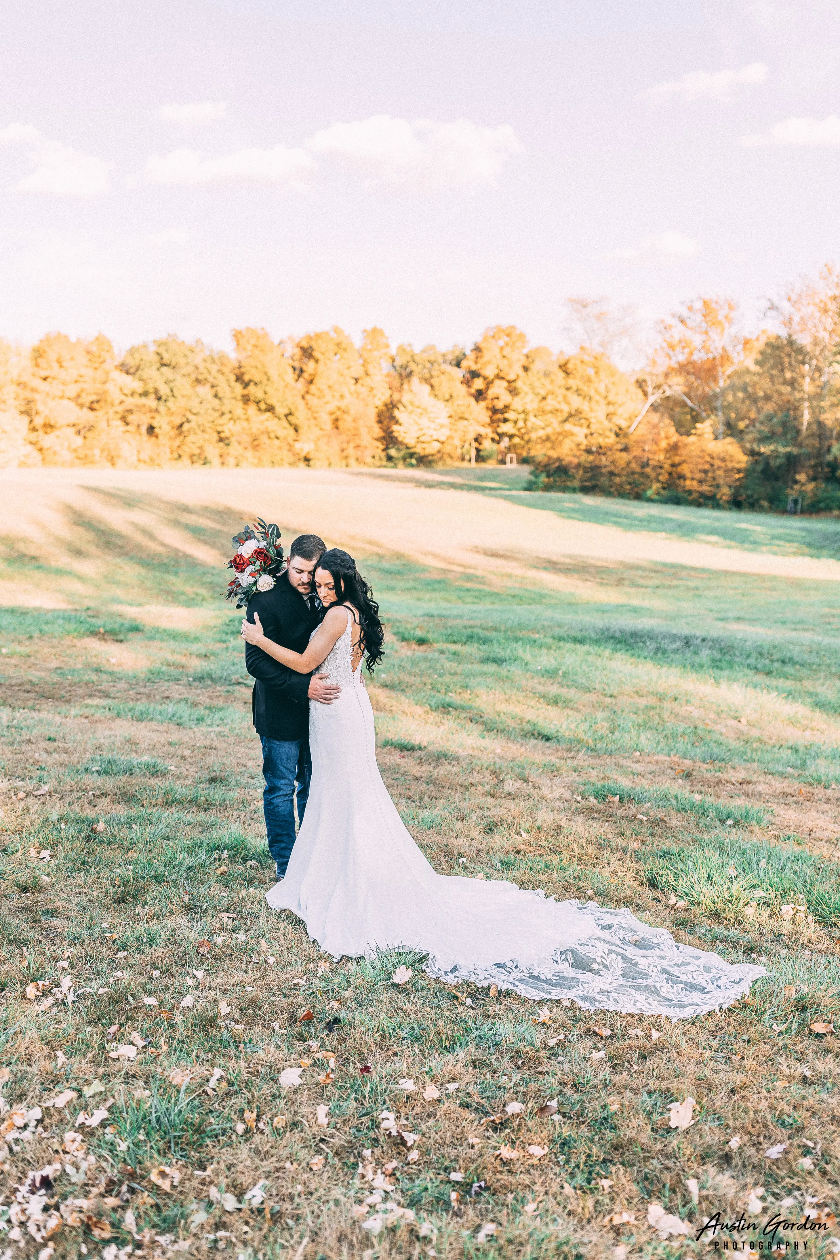 Bride Wearing Crepe Sheath Wedding Dress Called Alda By Rebecca Ingram Hugging Groom