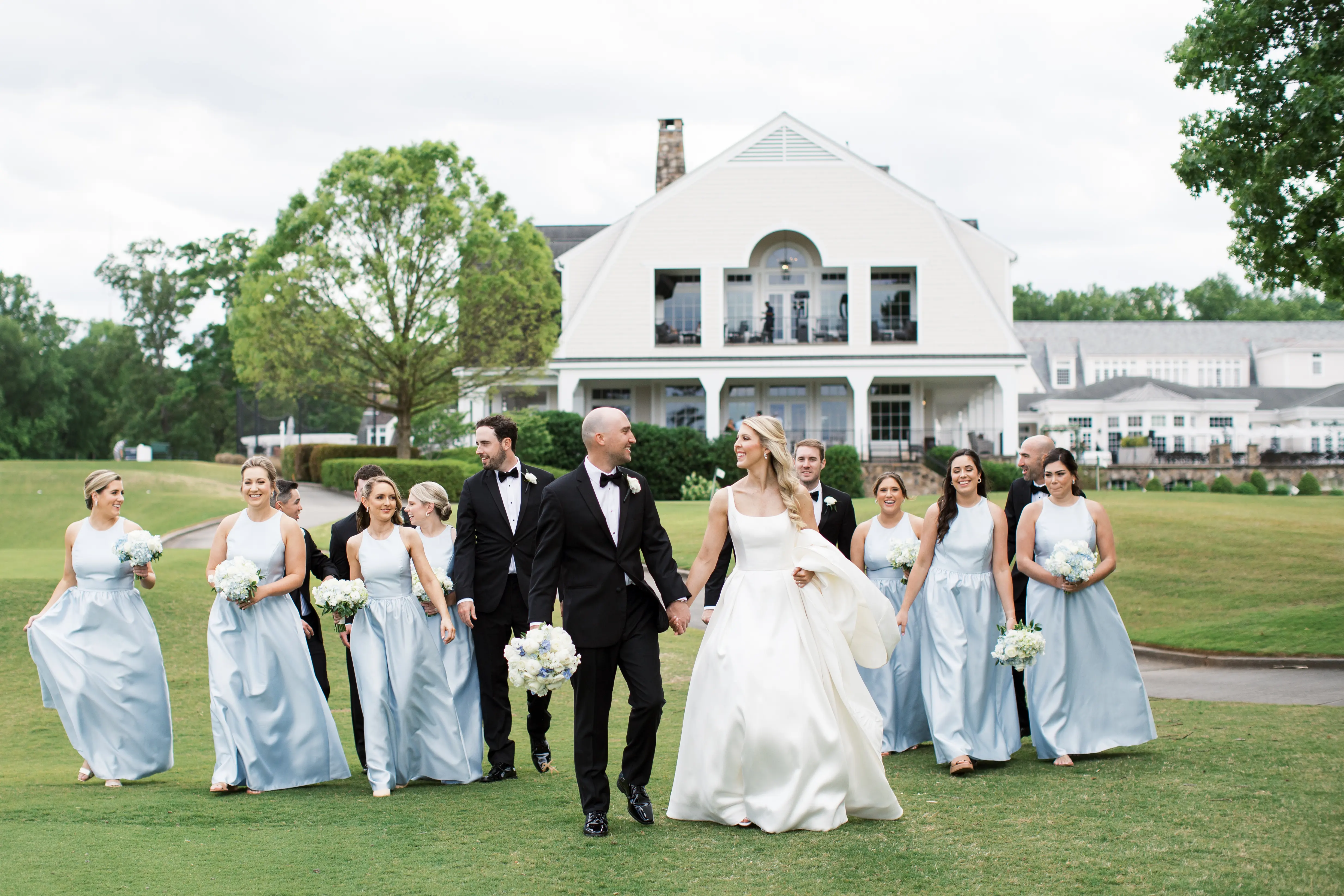 Bride In Satin A-Line Wedding Dress Called Selena By Maggie Sottero With Groom And Bridesmaids In Blue