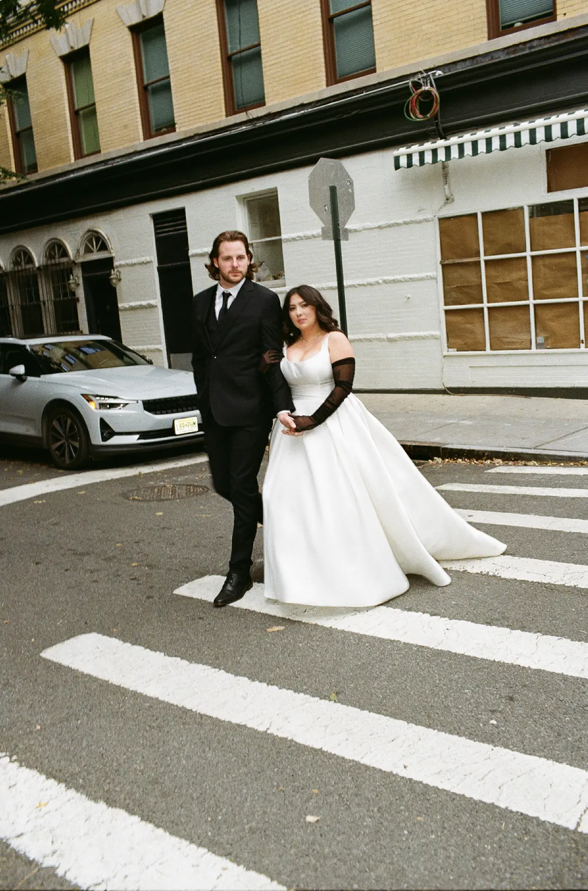 Bride Wearing Simple Aline Wedding Dress Called Selena By Maggie Sottero With Groom Walking Across The Street