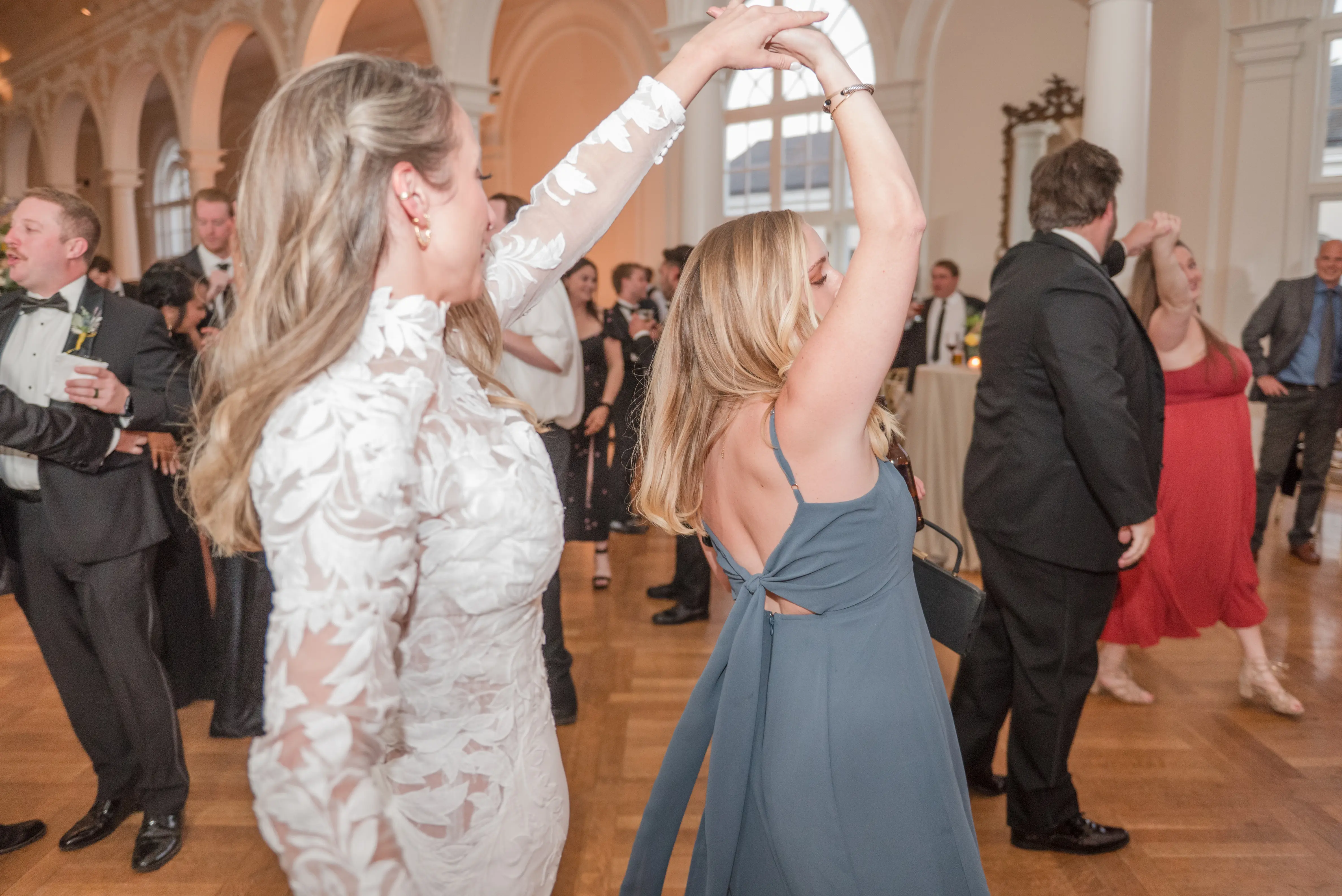 Bride wearing Dionne wedding dress by Rebecca Ingram spinning her friend