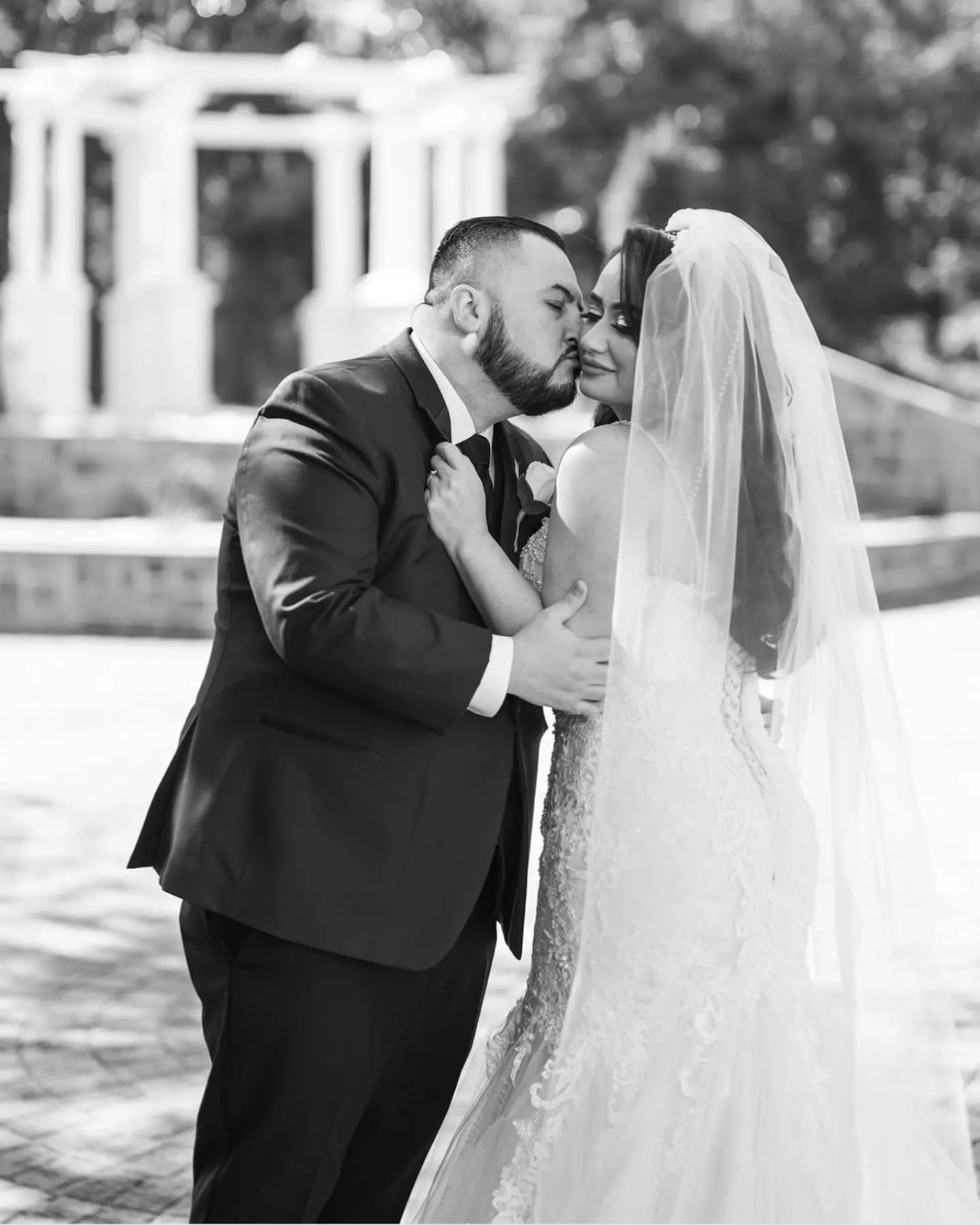 Groom Posing With Bride In Glamorous Glitter Tulle and Lace Mermaid Wedding Dress Called Lonnie Lynette By Maggie Sottero