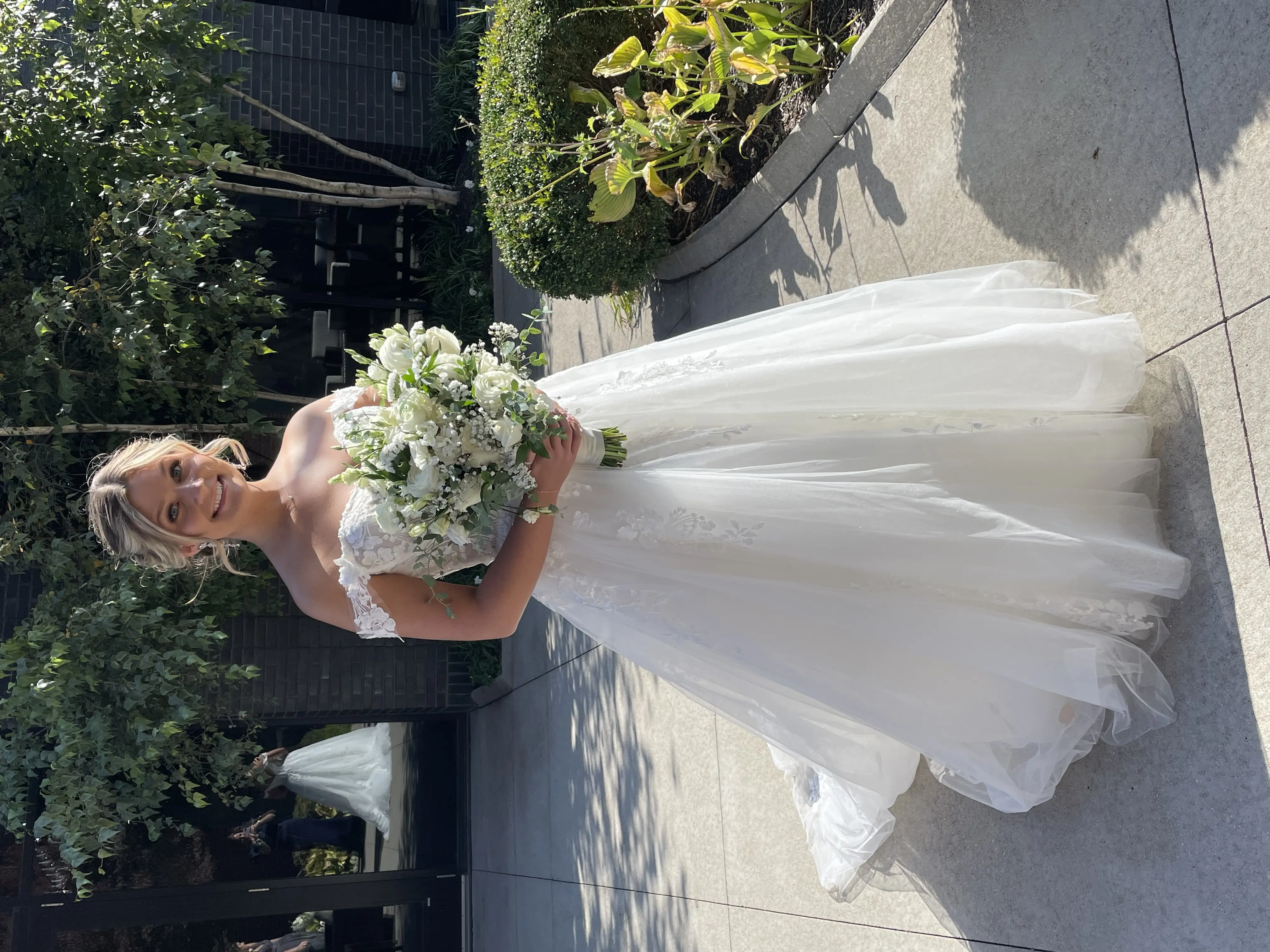 Bride wearing Harlem wedding dress by Maggie Sottero