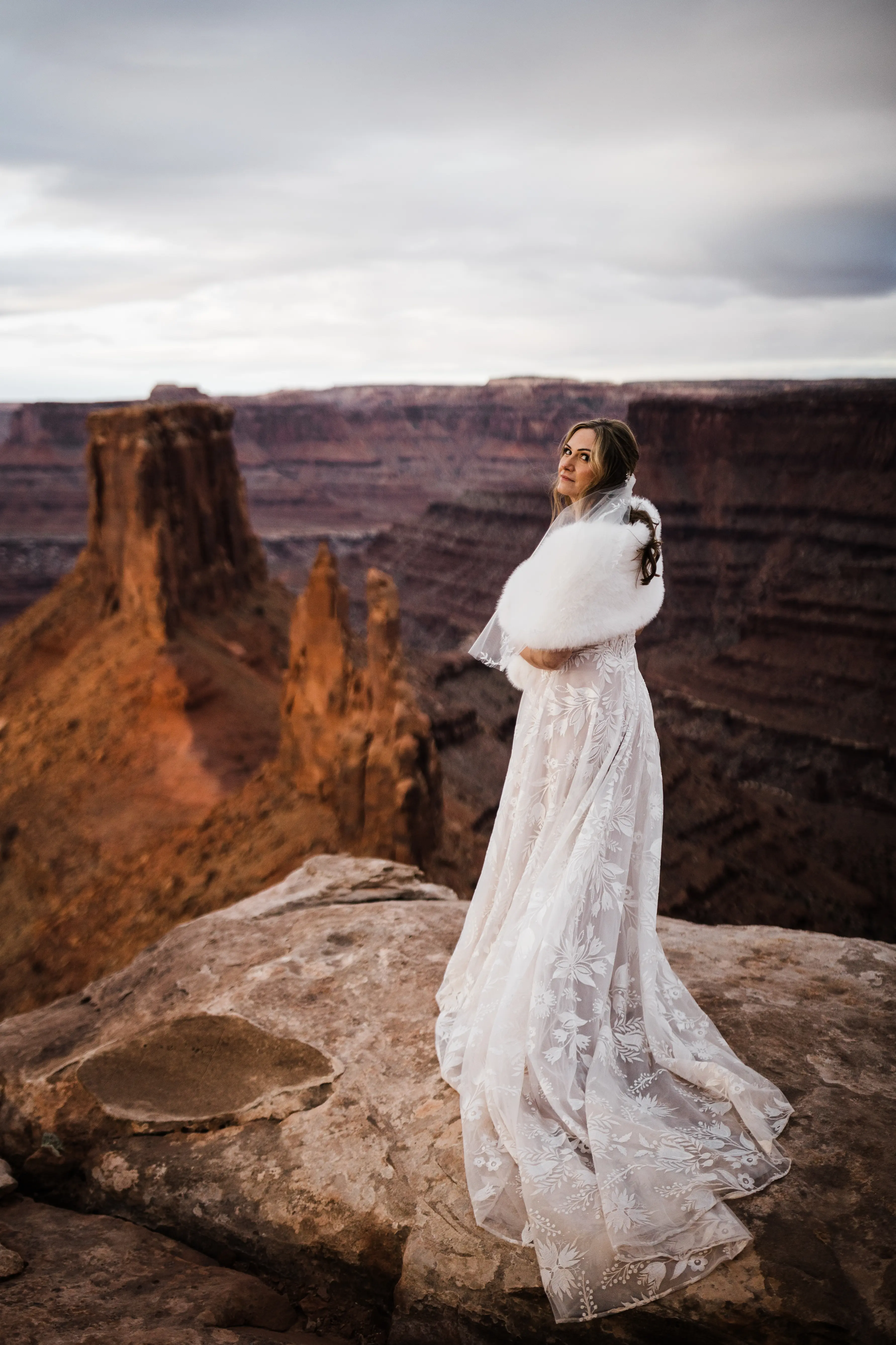 Bride Wearing A White A Line Wedding Dress Named Keisha By Maggie Sottero With Views Of Red Rock In The Background