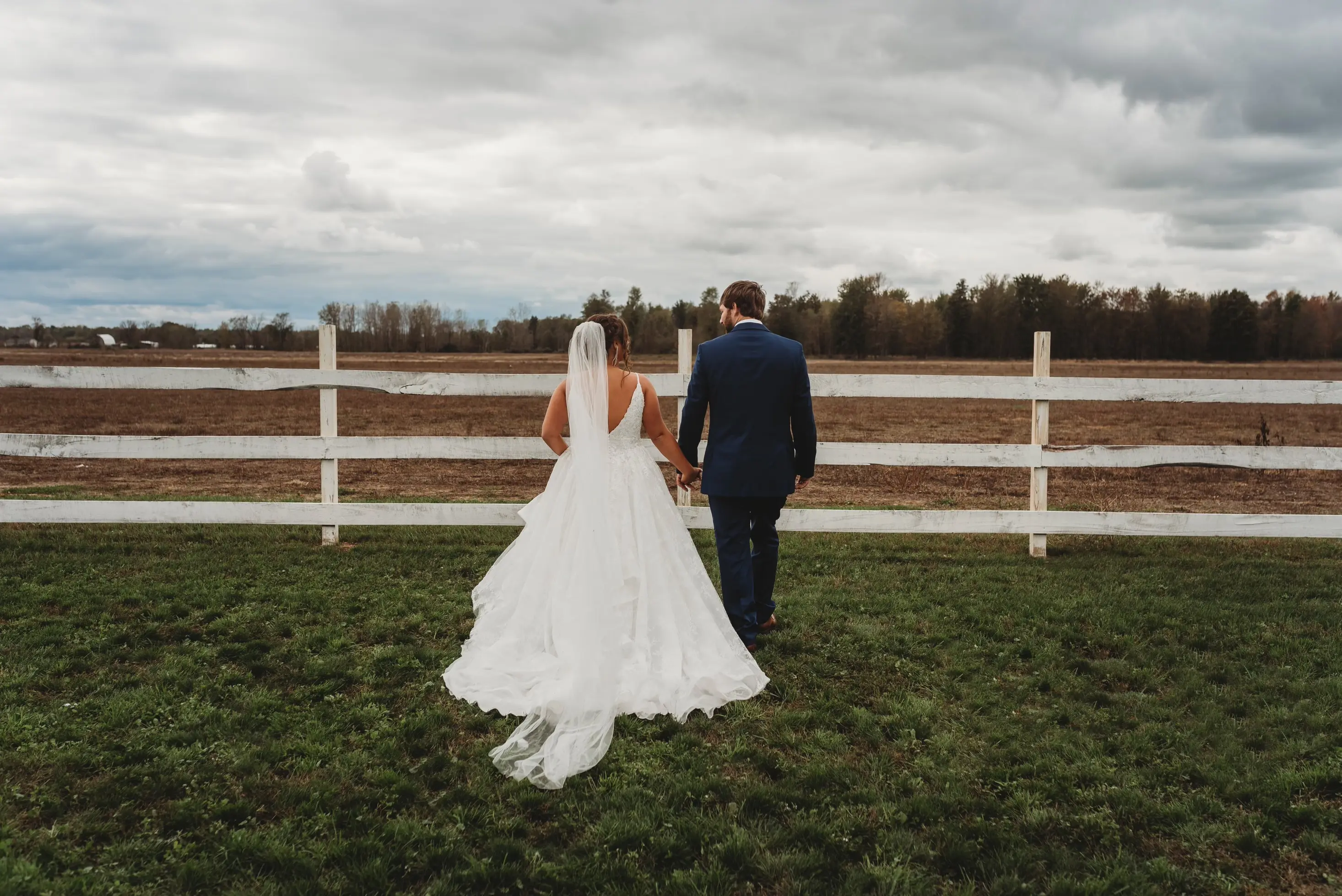 Bride In Lace Ruffled Wedding Dress Called Yuri By Maggie Sottero At Wedding Ceremony With Groom
