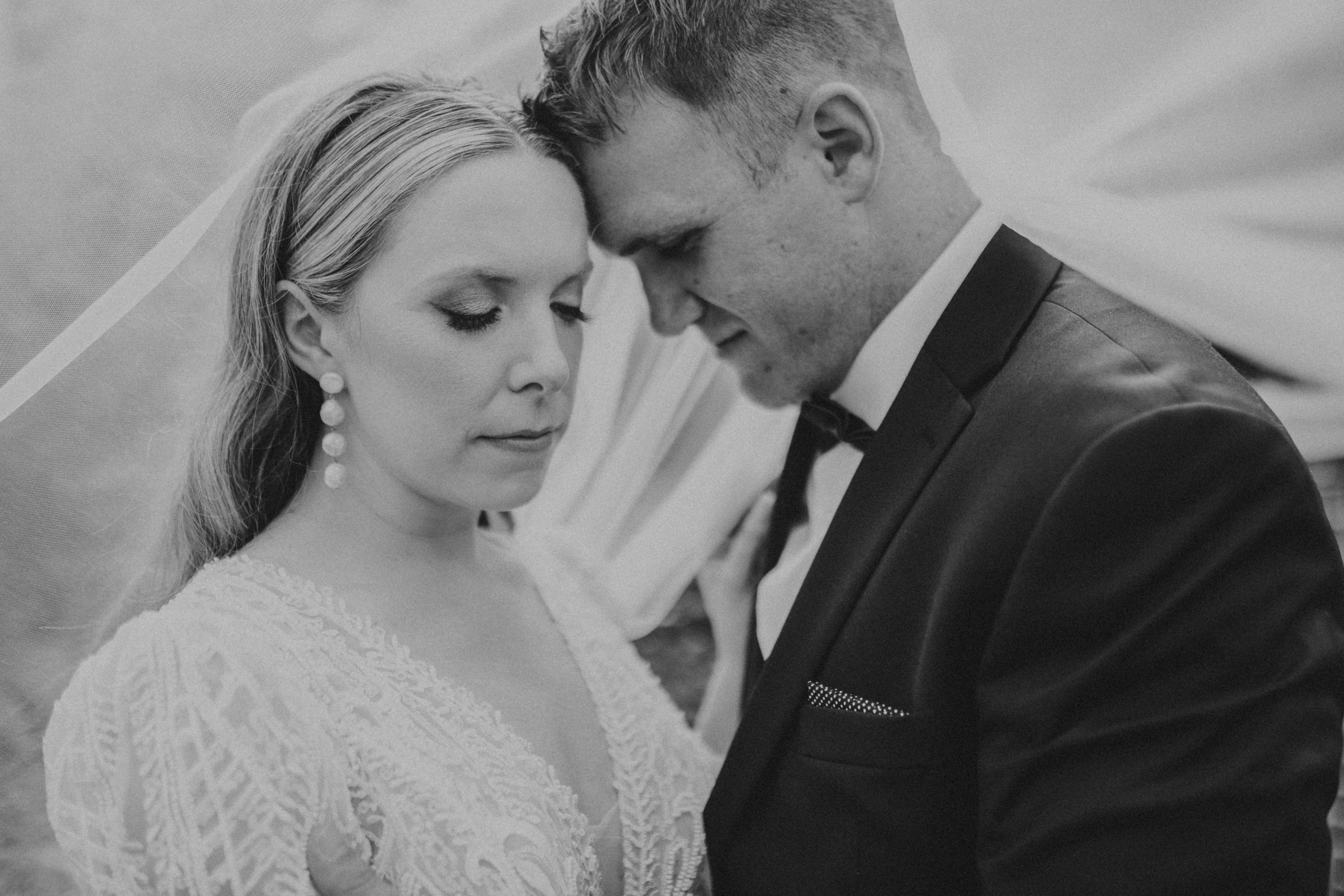 Bride and groom forehead to forehead.