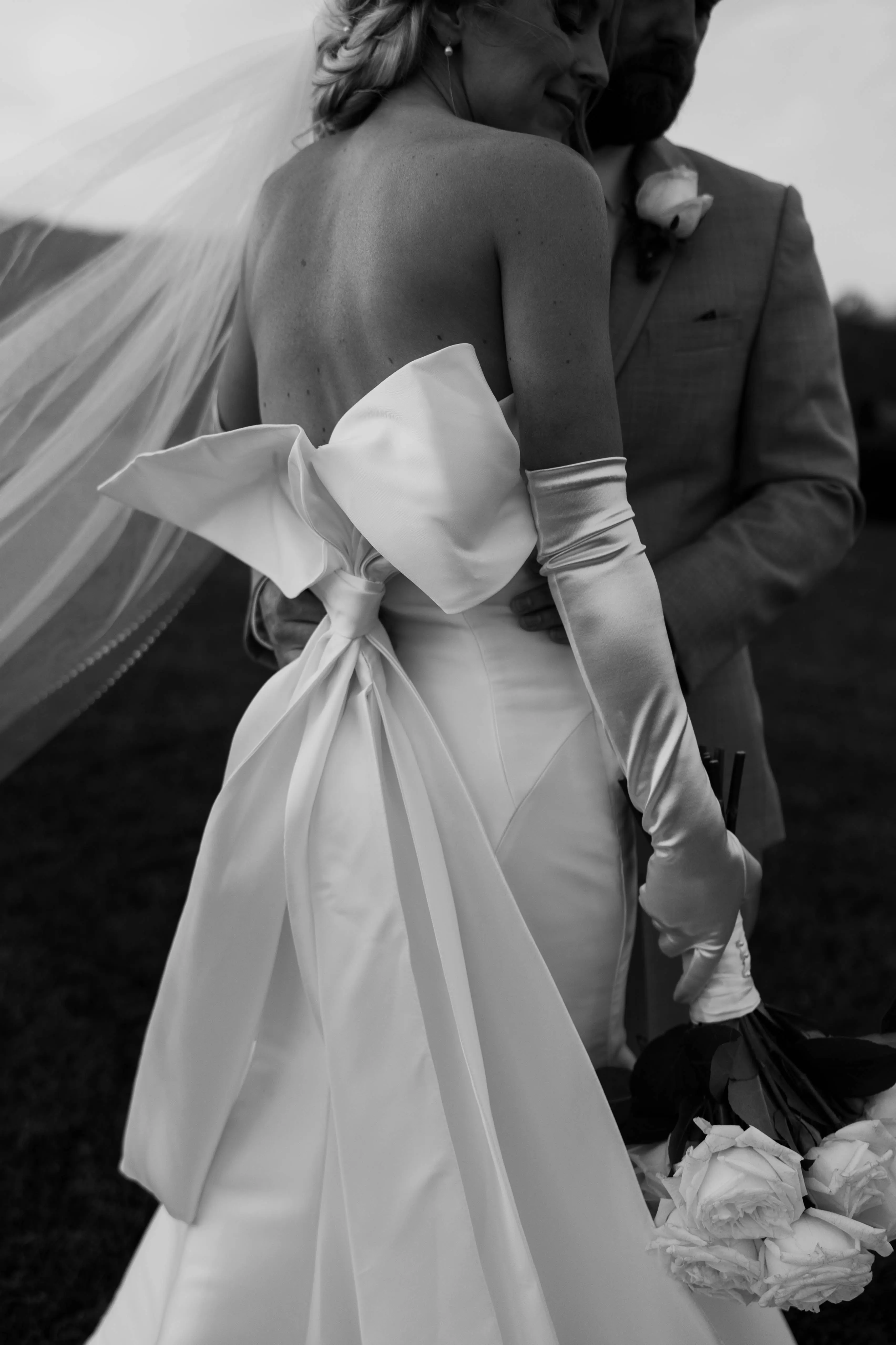 Groom With Bride In A White Strapless Wedding Dress Named Mitchell By Maggie Sottero