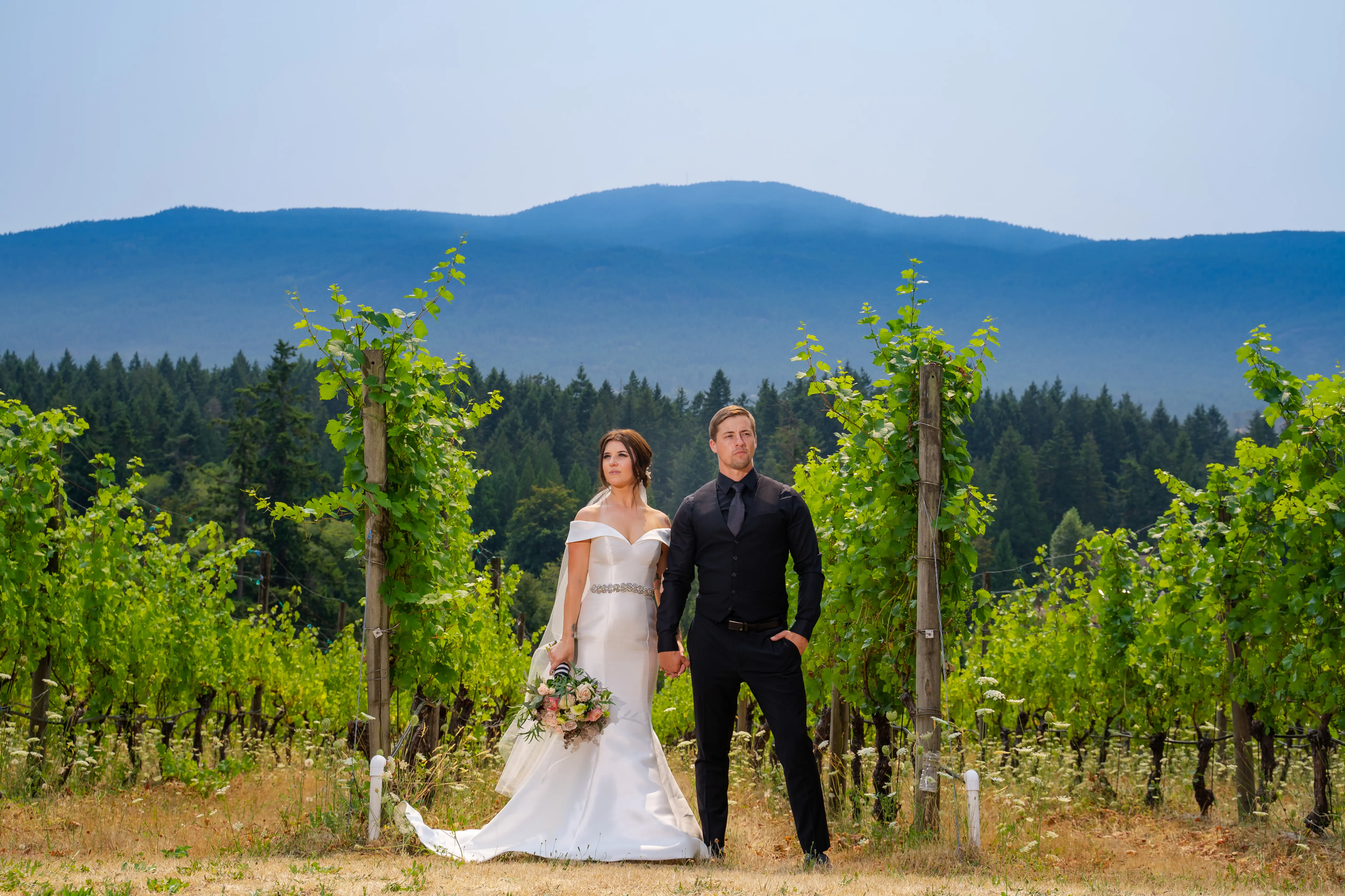 Bride Wearing Simple Classic Wedding Gown Called Josie By Rebecca Ingram With Groom