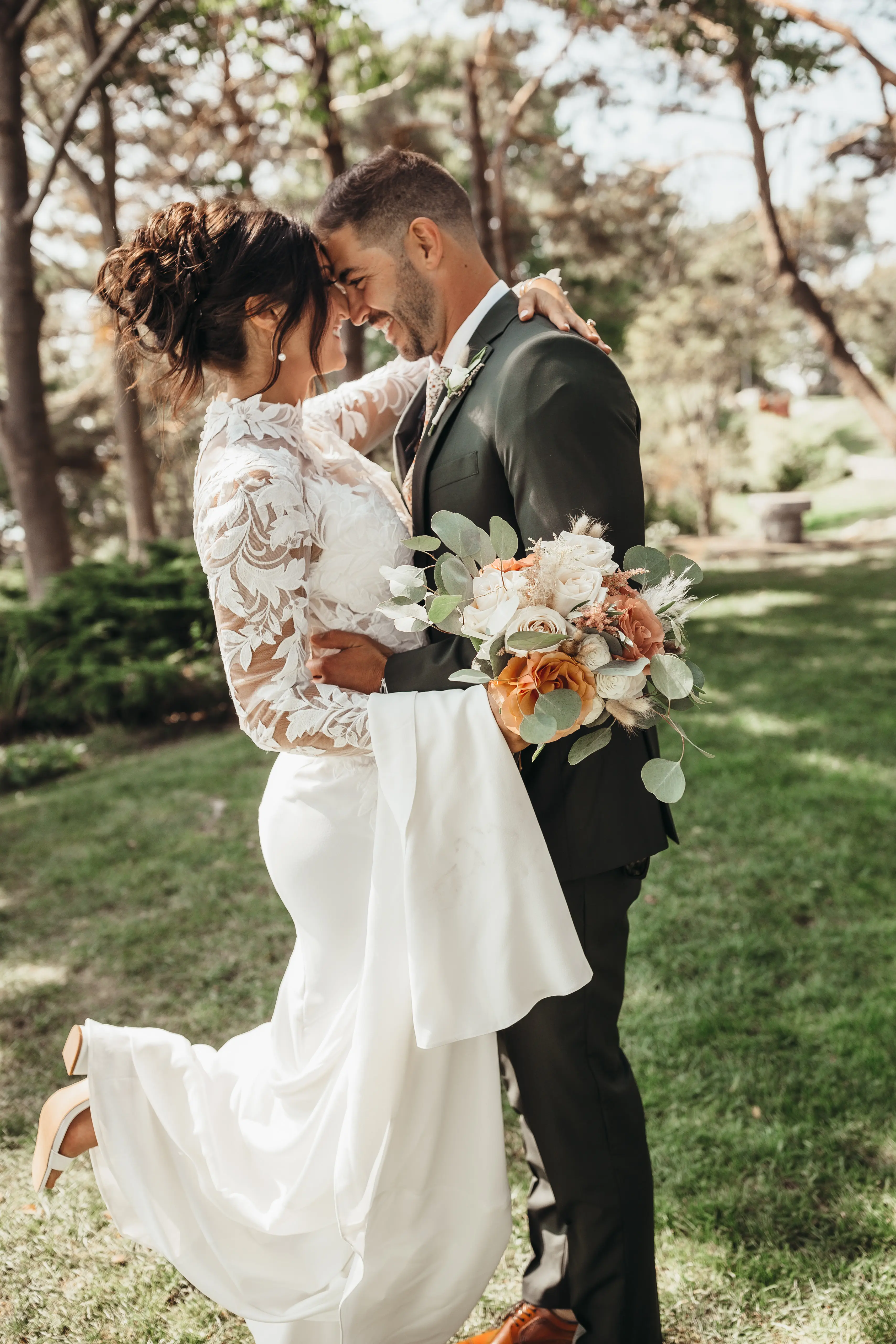 Bride Wearing Crepe And Lace Bridal Dress Called Dionne By Rebecca Ingram With Groom Looking At Each Other